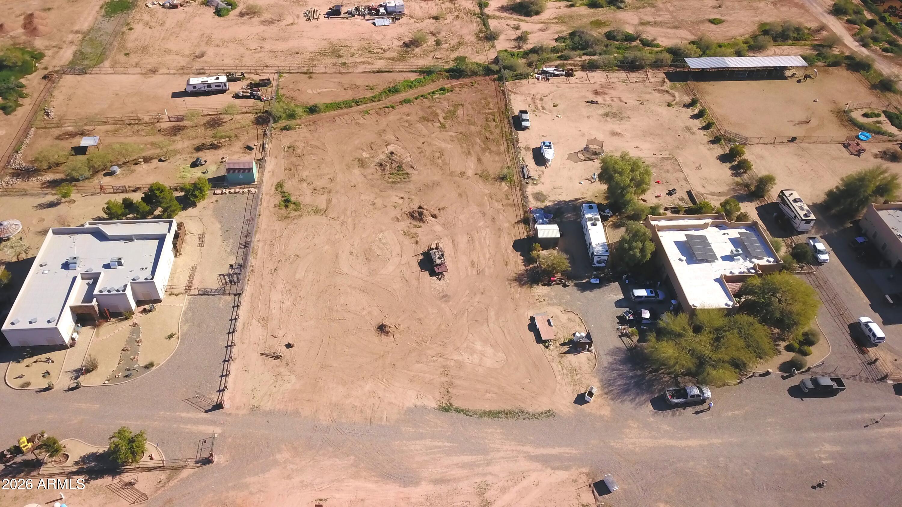 MOTIVATED SELLER! Build your dream home and/or bring your horses to this fantastic 1.21-acre parcel in Wittmann, AZ! Engineering, grading and architectural design has already been completed by the seller possibly saving the buyer time and expense with the building process. This rectangular lot measures approximately 330 ft x 159 ft with road frontage on N 252nd Drive. Horse-friendly w/ nearby open desert and riding trails, this property is ideal for those seeking space, privacy, and a true Arizona lifestyle. Enjoy the convenience of a shared water well, with electric and water connections at the property. NO HOA, and is surrounded by neighboring homes already built. Plenty of room for a custom home, horses, RVs, and toys. Don't miss this excellent opportunity to own usable acreage with u