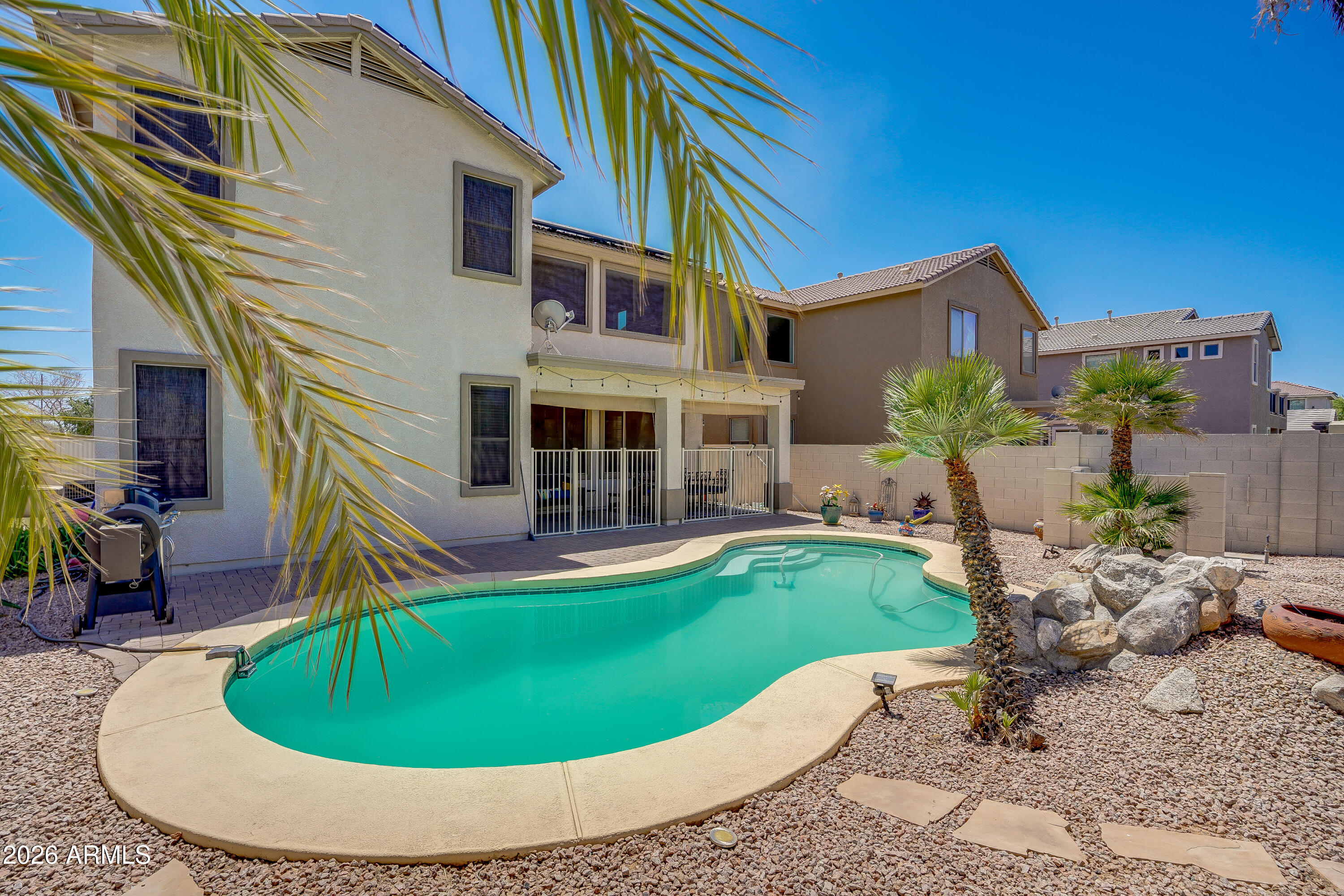 Welcome to this beautifully updated 3 bedroom home tucked away on a cul-de-sac lot in one of Surprise's most convenient locations. With an open concept floor plan, prepaid solar, a sparkling swimming pool, and a 3 car garage, this home checks all the boxes for comfortable Arizona living.

Inside, you'll find updated flooring, newer appliances a spacious layout designed for both everyday living and entertaining, with multiple living and dining spaces that flow seamlessly together. The floor plan offers added flexibility for growing families, guests, a home office, or workout space. There's also beautiful views of the White Tank Mountains.

Step outside to your private backyard retreat featuring a refreshing pool and space to relax, entertain, or enjoy sunny Arizona afternoons. The entire exterior of the home was also painted in 2025.  The prepaid solar is a huge bonus, helping provide energy efficiency and long-term savings.

Located just minutes from Prasada's shopping, dining, and entertainment, with easy access to Loop 303, this home also sits within a neighborhood known for its walking trails, parks, and nearby elementary school. Whether you're looking for convenience, community, or room to grow, this home offers the perfect blend of it all.
