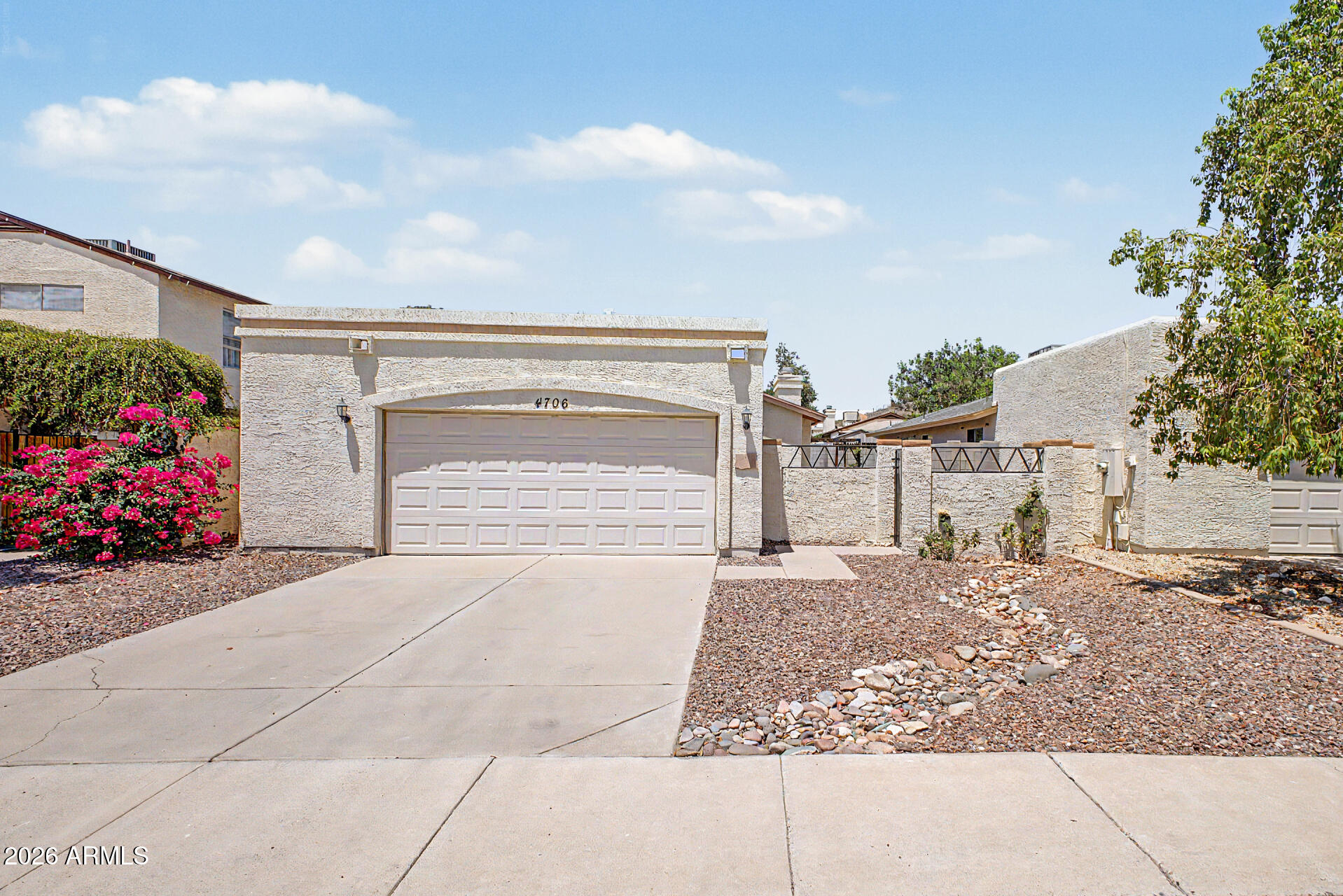 This charming North Glendale home offers a desirable split floor plan, granite countertops, cozy indoor fireplace, and a bright welcoming feel throughout. Enjoy a peaceful front garden area with rose bushes and a screened-in AZ Room off the primary suite perfect for relaxing year-round. Features include a 2-car garage, access to a community pool and greenbelt play area close by. Conveniently located near shopping, dining, schools, hiking and super easy freeway access. This is a wonderful opportunity to own a low-maintenance home full of comfort and charm!