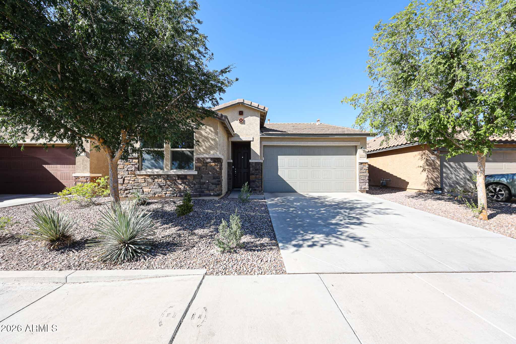 Don't miss this opportunity in Coldwater Ranch. Move-in ready and well maintained, This single-level 3-bedroom, 2-bath home  functional and inviting layout with an open-concept kitchen featuring an island and stainless steel appliances.  The home flows seamlessly into the main living space--ideal for everyday living and entertaining. Energy features include solar, helping provide more predictable utility costs. Additional features include an EV charging outlet in the garage. The primary suite offers a separate tub and shower, double vanity, and generous closet space. Home includes washer, dryer and refrigerator. Outside, low-maintenance landscaping with synthetic turf and a covered patio create an easy-care outdoor space.