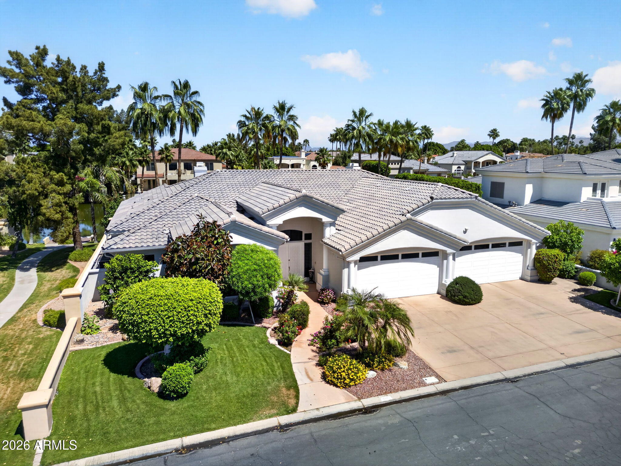 Waterfront BASEMENT home in West Lake Estates. This is a combination almost impossible to find in Gilbert. 5,731 sqft, 6 bed, 4.5 bath, private dock and direct lake access. The lot is exceptional, the floor plan is rare, and the lifestyle is real. Bring your vision. Main level: soaring ceilings, open great room, granite kitchen, double-door den (or 6th bed), and a primary suite with lake views, fireplace, and spa ensuite. The backyard delivers: negative-edge pool & spa, built-in BBQ, sunken fireplace, outdoor shower, and a private dock for kayaking or paddleboarding at sunrise. Basement: fully finished with a complete second kitchen, 2 bedrooms, full bath, fireplace, and its own private entrance, purpose-built for multi-generational living, guests, or serious rental potential. A built-in dumbwaiter connects both levels. Val Vista Lakes amenities include a clubhouse, sandy beach lagoon, tennis, pickleball, fitness center, heated Olympic pool, and waterfront trails. One of the most coveted communities in the East Valley and this is one of its rarest homes. Investor, remodeler, or lifestyle buyer the bones, the lot, and the lake are all here. This is the ONE!