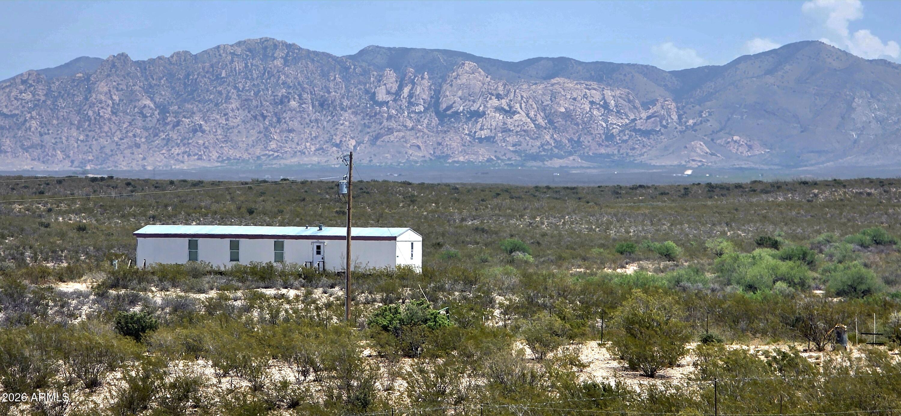 A three bedroom, two bath manufactured home on 10.117 acres. The home sits on a hill, the views from this property are stunning! Located in a quiet rural area and only a short drive to the heart of Tombstone.