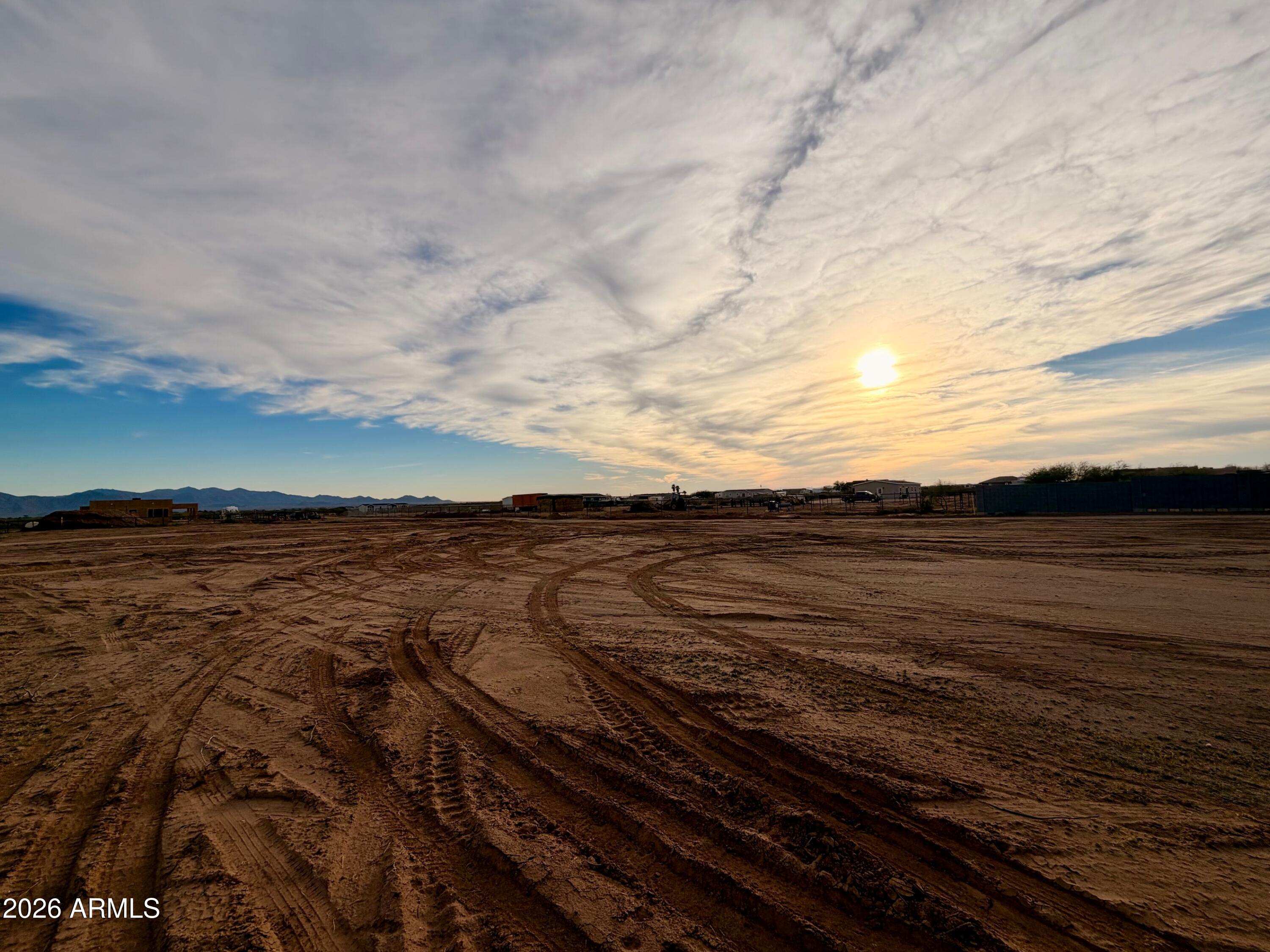 5 ACRES CURRENTLY SPLIT AS FIVE 1+ACRE ADJACENT PARCELS AND PACKAGED HERE AT A DISCOUNTED PRICE. Exceptional lots, cleared and ready to go in the quiet community of Wittmann. NEW PRIVATE WELL (INSTALLED APRIL 2026). Electric at lots. No Luke AF APZ. Surrounded by new custom homes/ranches. CURRENTLY NO DEED RESTRICTIONS. No HOA. Improved road. EZ access to US60/Grand, the 303, Lake Pleasant, Shopping, Dining, and a quick trip to Vegas. Buyer to verify all info. Septic will be needed. Seller may carry, ask for terms. Great opportunity for builder or Roper.