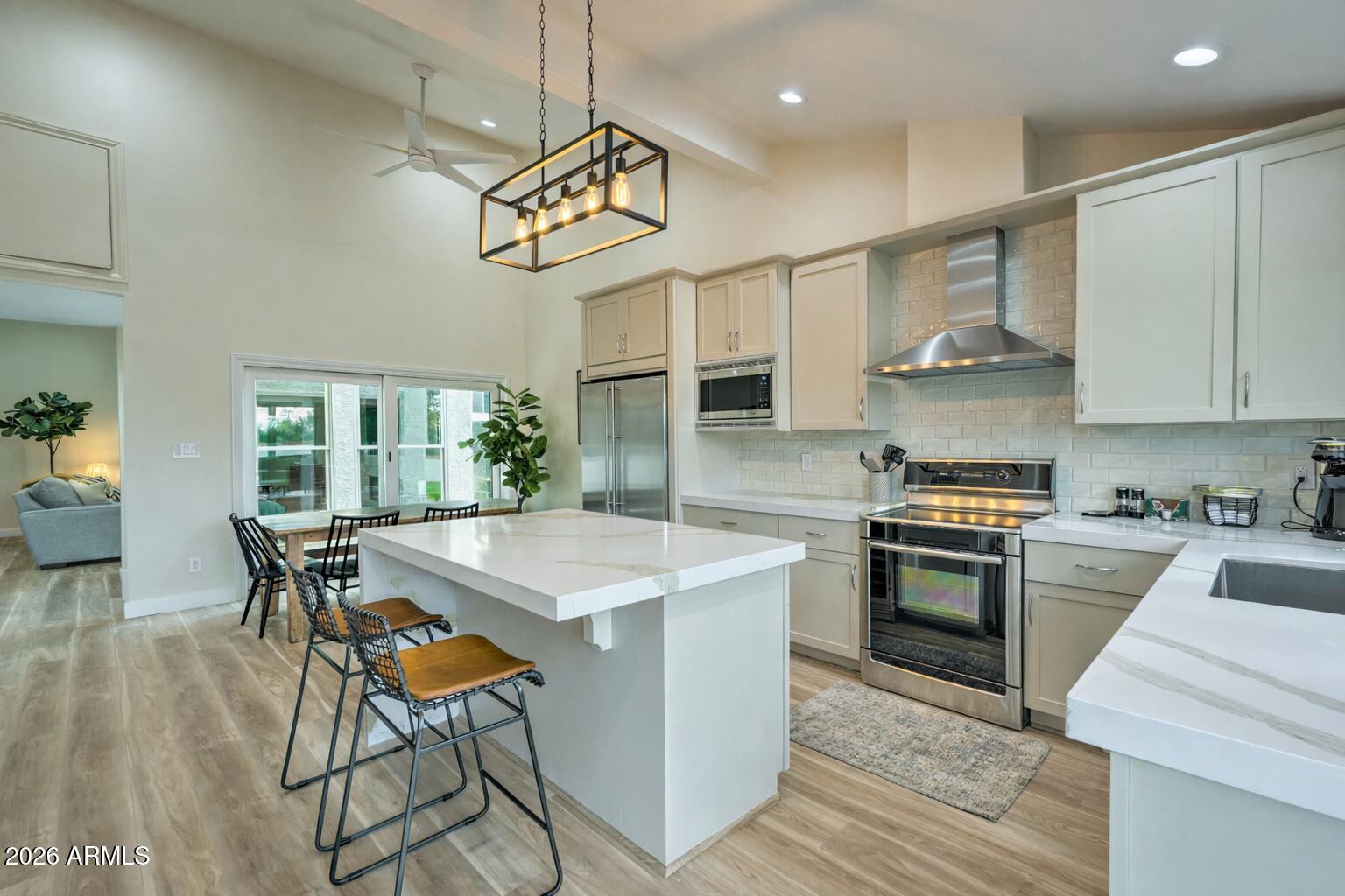 Welcome to this stunning remodeled single-level home in the prestigious gated community of Spanish Oaks, McCormick Ranch. This private end-unit showcases wide-plank flooring, a dramatic floor-to-ceiling fireplace, and an abundance of natural light. The chef's kitchen features quartz waterfall countertops, a generous island and custom cabinetry. The primary suite offers a serene retreat with backyard access and an expansive walk-in closet. Spanish Oaks amenities include a manned guard gate, community pool and spa, and lush greenbelt pathways just minutes from Scottsdale's finest shopping, dining, and entertaining.
