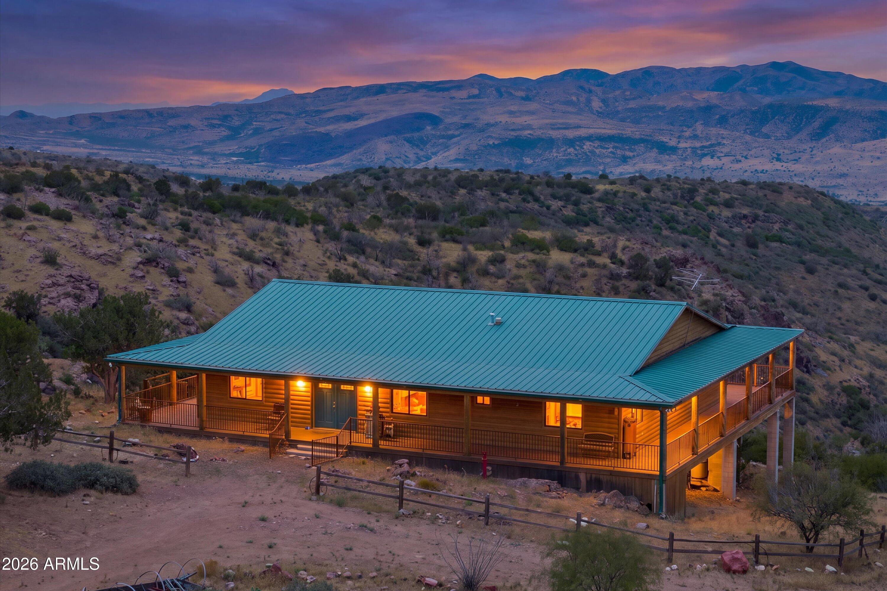 Experience true Arizona freedom where the pavement ends and the adventure begins. Perched high above the desert on just over 10 private acres north of Desert Mountain, this one-of-a-kind off-grid retreat captures breathtaking panoramic views in every direction. Built for complete self-sufficiency with solar and wind power, a backup generator, propane, and extensive water storage, it's a place where independence isn't just a feature--it's a way of life. Complete with a patented gold mining claim and room for horses and outdoor adventures, this is a rare opportunity to own a piece of the untamed Arizona frontier.