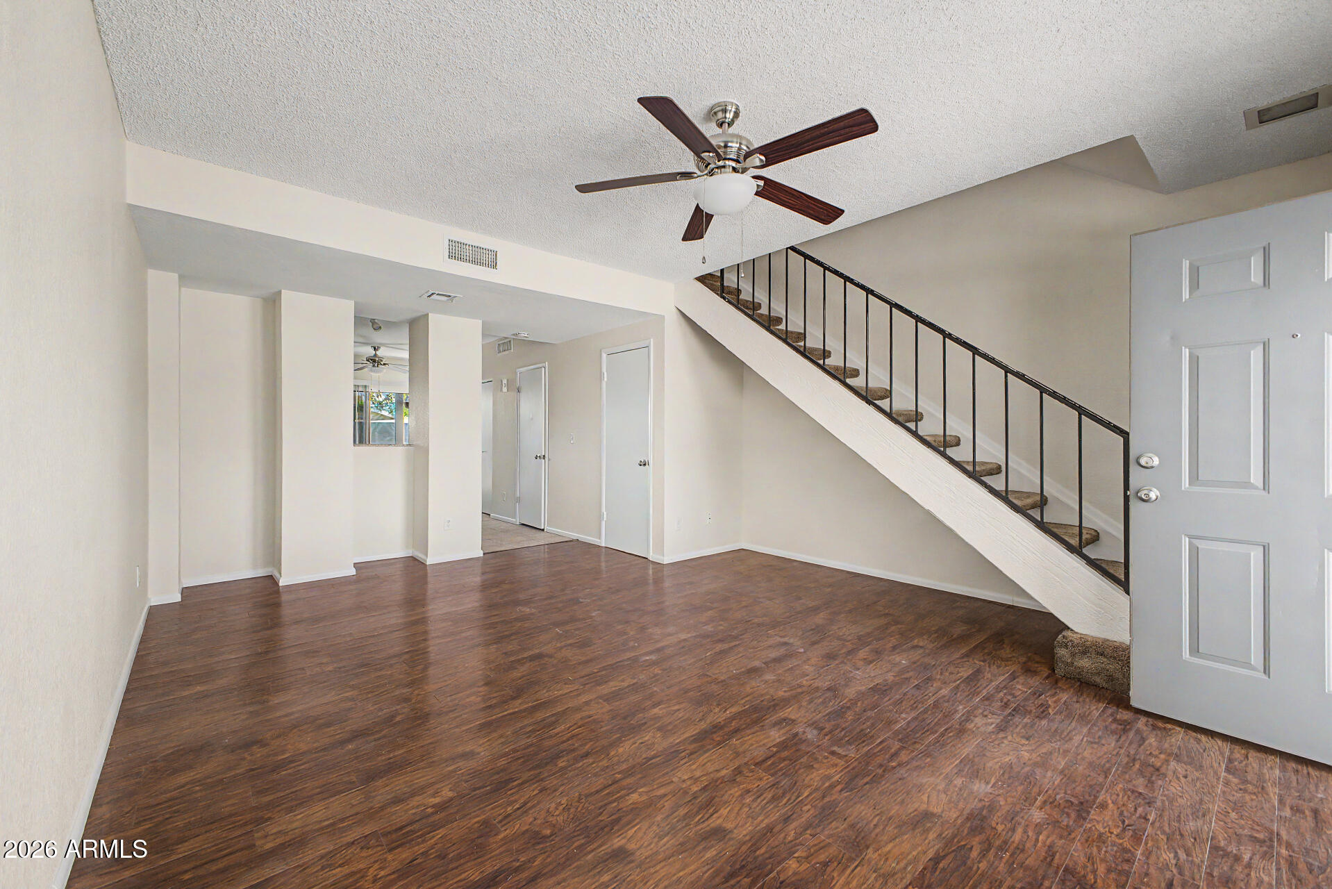 Conveniently located and thoughtfully designed, this 2-story townhome offers dual primary suites, functional living space, and fresh updates throughout. The spacious open living area flows into an eat-in kitchen, creating a comfortable layout for everyday living and entertaining. Fresh interior paint gives the home a clean, updated feel. Downstairs features indoor laundry hookups, a convenient powder room for guests, and access to a private covered patio with an attached exterior storage room--perfect for additional storage and outdoor relaxation. Upstairs, both bedrooms offer the privacy and convenience of their own en suite bathrooms, making this an ideal setup for roommates, guests, or flexible living arrangements. An assigned covered carport parking space completes the home.