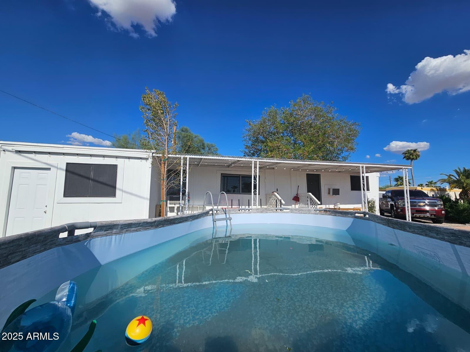 Don't miss this beautiful corner-lot home in Apache Junction! With low lot rent that covers water, sewer, and trash, this property offers incredible value. The remodeled bath, tankless water heater, upgraded kitchen, and RV access make it move-in ready. Come see why this home is the perfect blend of comfort and convenience!