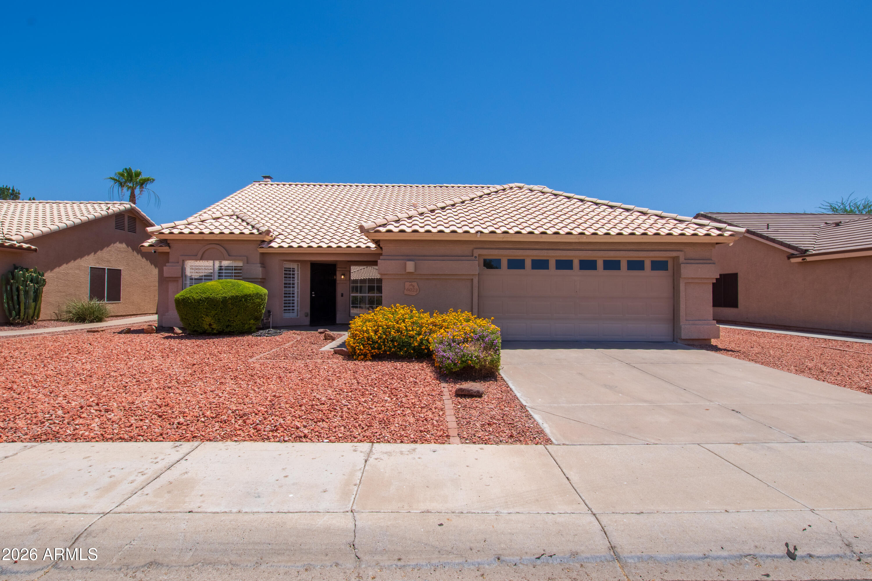 Welcome to this beautifully maintained 4 bedroom, 2 bath home in the highly desirable Arrowhead Ranch! This home is move-in ready with thoughtful updates throughout, including NEW carpet, newer water heater (2024), added attic insulation, and an HVAC system recently tuned up for the Arizona summer. The spacious layout flows seamlessly into a large backyard, perfect for entertaining--featuring a sparkling PebbleTec pool. The garage is equipped with built-in cabinets, providing ample storage. Ideally located near outdoor recreation at Thunderbird Conservation Park and just minutes from golf at The Clubs at Arrowhead, gym, dining, and shopping. This home combines convenience with lifestyle. Don't miss the opportunity to own in one of Glendale's most sought-after neighborhoods!