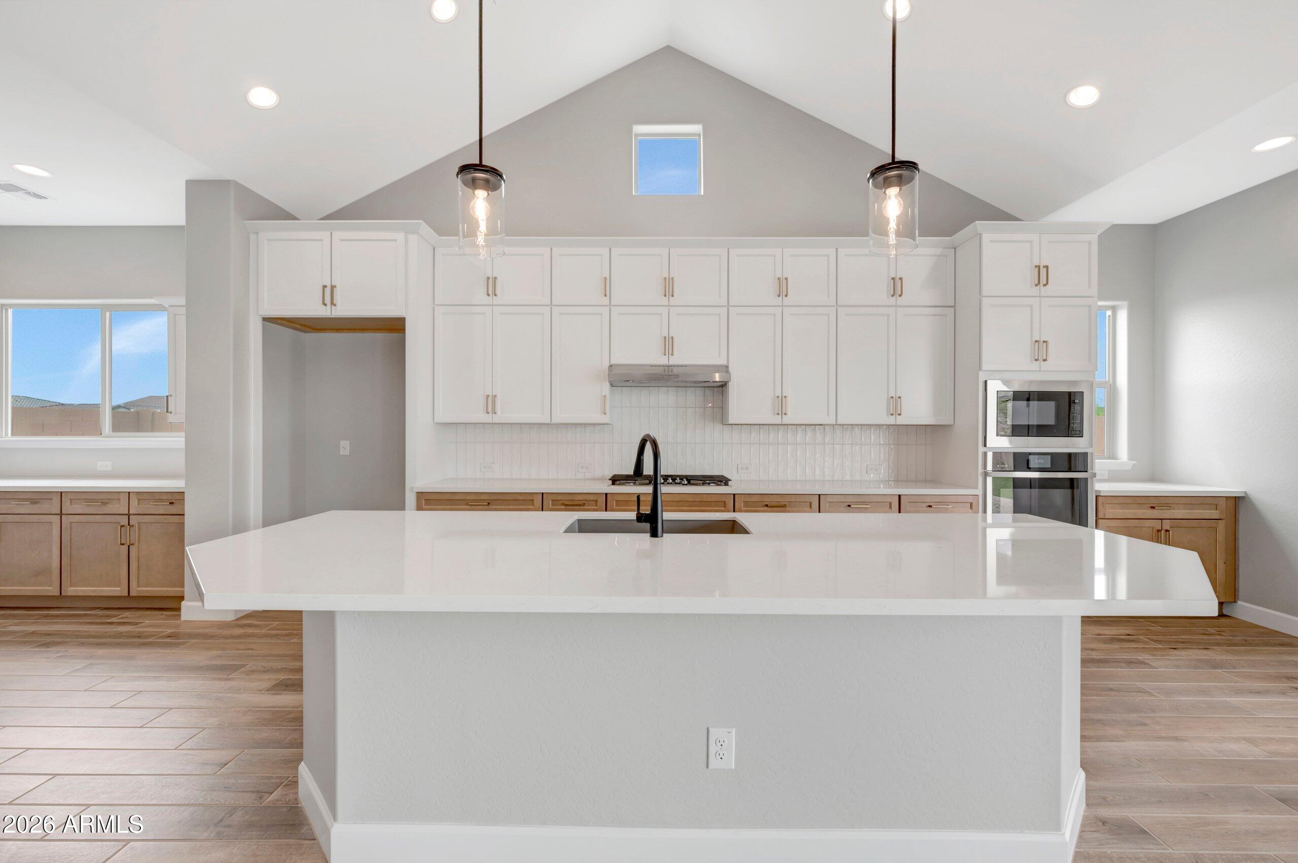 BRAND NEW single level home on 12,695SF corner homesite w/4 beds, 3.5 bath, enclosed study and flexible tv room with 4 car garage; gorgeous chef's kitchen with 2-tone cabinets, white tiled backsplash, tons of storage, a huge island with quartz tops, added upper and lower cabs in dining area; GE Profile stainless appliances w/gas cooktop; cathedral ceiling in kitchen and family room; 16' stacking sliding glass door at family opening to large backyard and huge energy efficient windows throughout; upgraded tile, carpet and pad, 2-tone paint and 8' doors throughout; 2X6 CONSTRUCTION AND EXTENSIVE NEW HOME WARRANTY; see you soon!