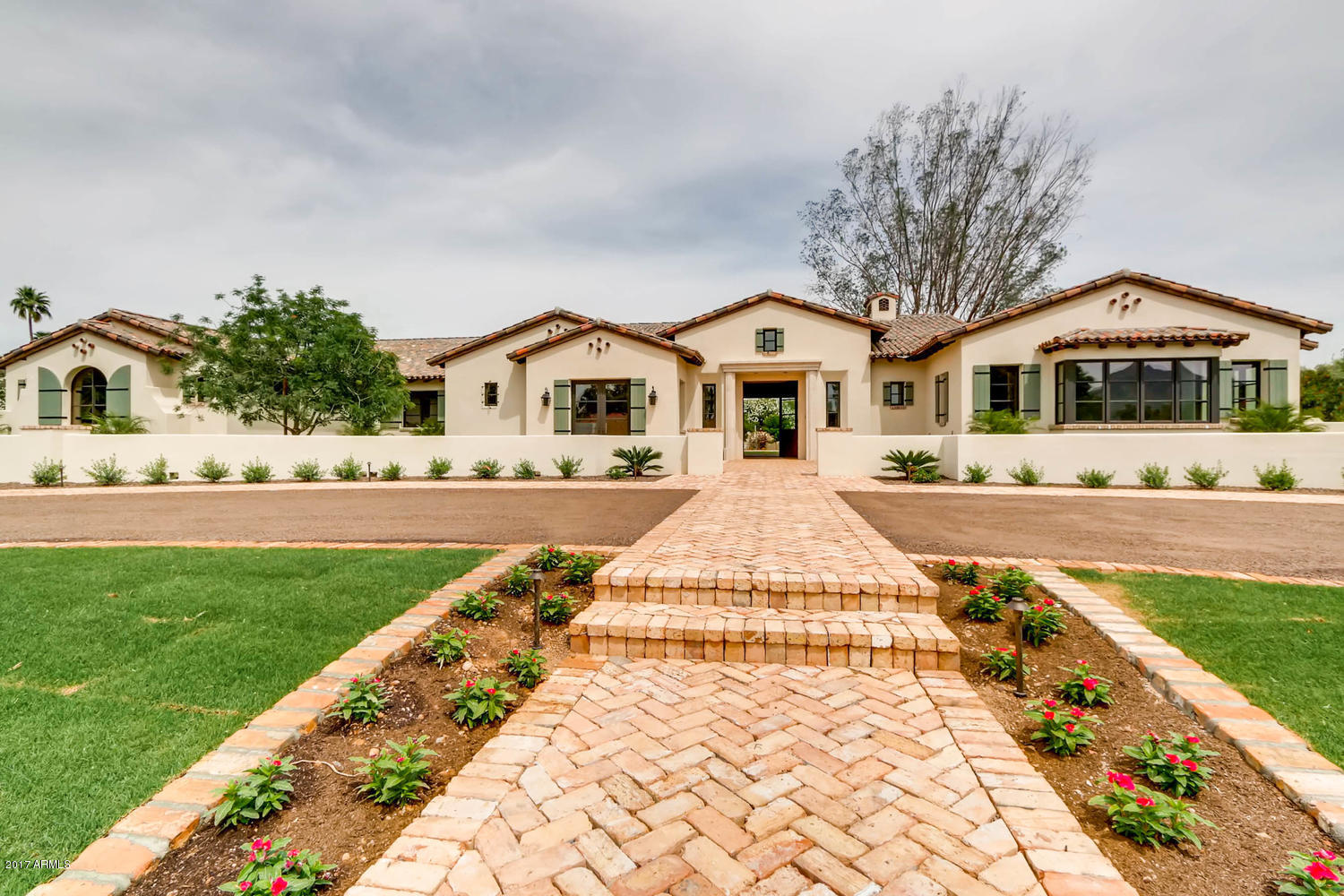 This elegant custom designed estate is a flawless combination of old world design and modern sophistication. A new masterpiece designed by Jim Blochberger.  Exquisite details inside and out. This new build has fabulous picturesque mountain views surrounding the property in the heart of Paradise Valley. Luxurious finishes and appliances throughout the home. Mountain views to the south, east and west. Stunning lot and gorgeous home for a family who enjoys entertaining inside and out. Exquisite touches include reclaimed brick and countless hand crafted detail. Formal dining room includes a wine cellar & french doors that open to a beautiful Chicago Brick patio. State of the art gourmet kitchen of your dreams with a butlers pantry and inside/outside bar connecting the stunning backyard space.