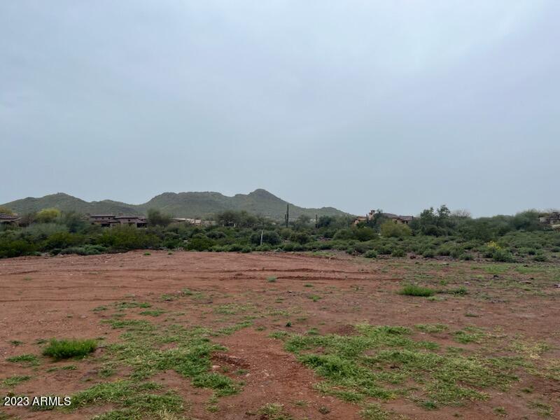 RARE FIND with this 1.25 acre lot! Boarders 2 sides of the golf course of Superstition Mountain gated subdivision with million dollar homes but NO HOA! This is one of only 4 lots with AZ water lines. All others in the area outside the gated superstition mountain subdivision and on shared wells.
Horse and detached RV garages are allowed in this GR zoning. Underground power conduits are in already.
Minimum home size is 1,700 and no manufactured homes are permitted. Underground power only. OWNER/AGENT