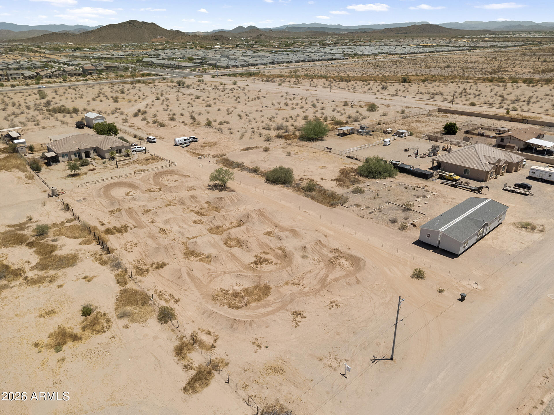 OVER 1 ACRE OF RAW LAND WITH ENDLESS POSSIBILITIES! Previously used as a practice race track, this unique property offers plenty of open space and abundant dirt ready for your vision--whether that's building your dream home, creating a private retreat, or making a smart land investment.

Located in an area experiencing continued growth and development, this parcel offers excellent long-term potential. Neighboring properties have water wells, and electric, cable, and phone services are available nearby, providing added convenience for future plans.

Enjoy the freedom of wide-open space, the flexibility to build to your needs, and the opportunity to own land in a rapidly developing area. A great opportunity for both homeowners and investors alike!