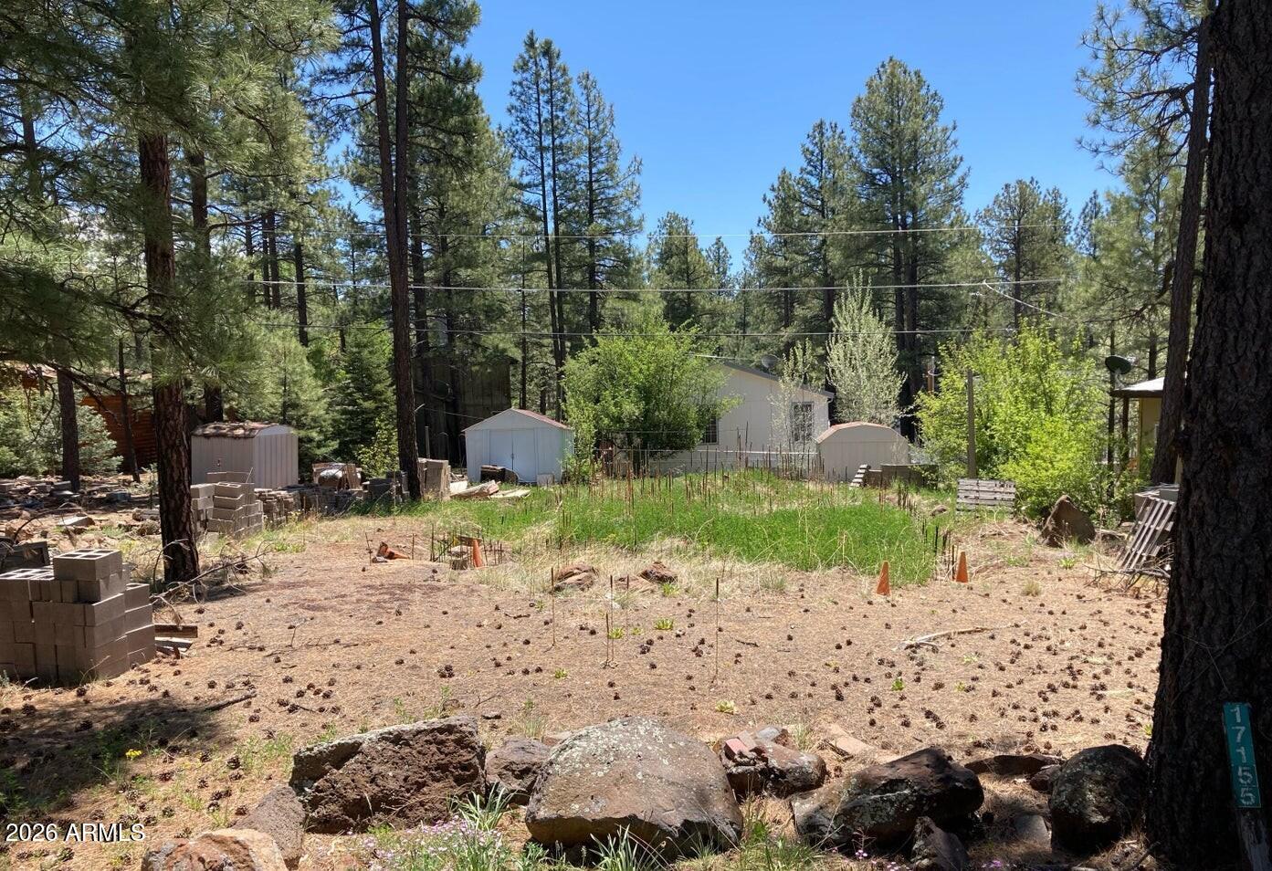Don't miss this rare 6,000 sq. ft. lot in Munds Park. Lot is zoned for a manufactured or single-family home. Beautiful heavily treed area with quick access and walking distance to the Iron springs trailhead leading you into the Coconino National forest.