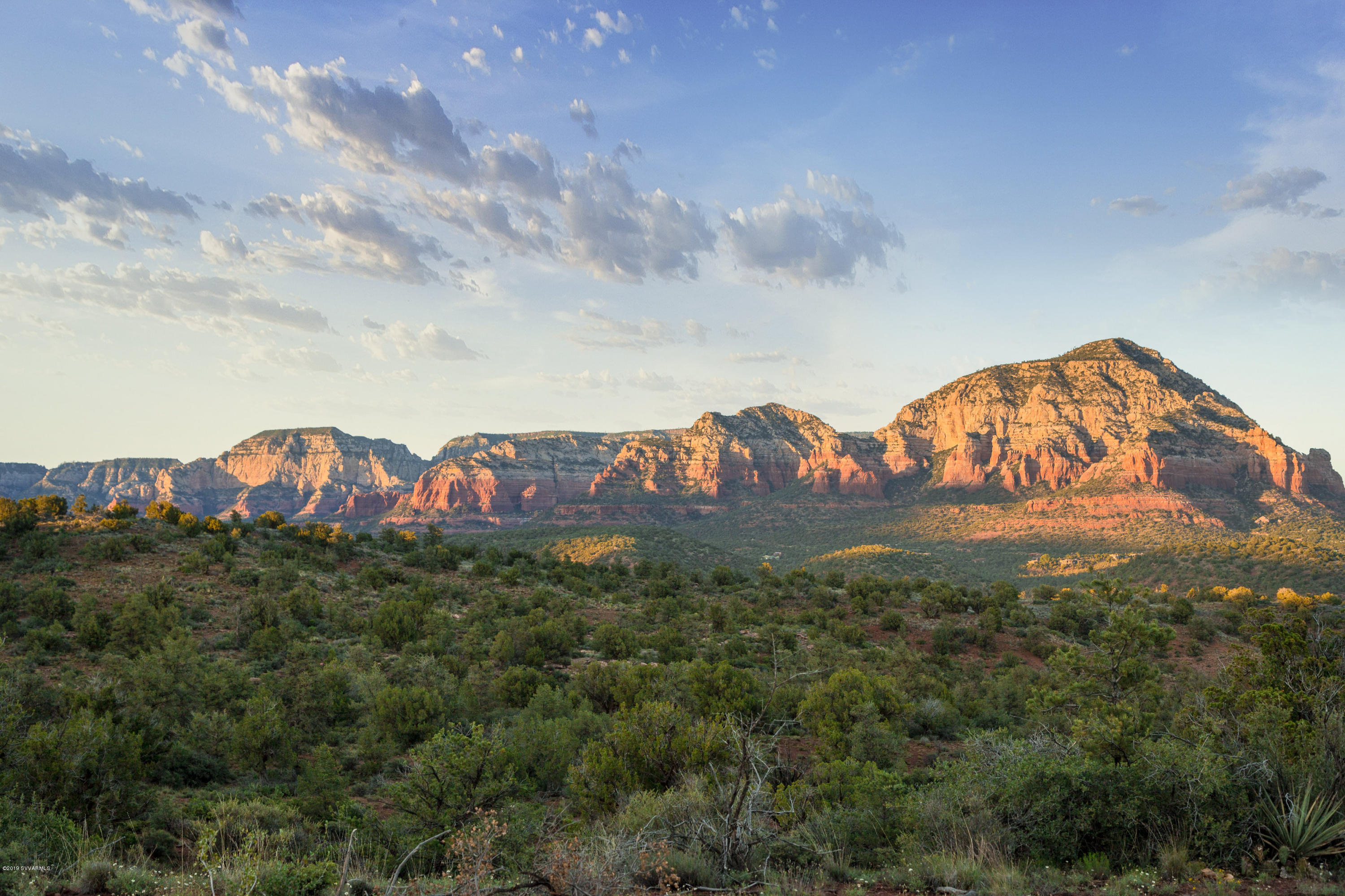 The Retreat at the Aerie is a one-of-a-kind private oasis of ±77.5 pristine red rock acres located within the gates of The Aerie – Sedona's most majestic luxury community. Framed by the red rock splendor of Sedona, and entirely surrounded by the Coconino National Forest, The Retreat at the Aerie is an exquisite and unique setting that will inspire your architectural dreams. The dramatic landscape varies from open grassland to dense pinon and juniper forest. The dynamic topography of the land and adjacent red rock mountains provide a spectacular setting in which to create a private and secluded estate that compliments this unmatched natural beauty. The property could be purchased for the development of one home site, or with the recordation of the approved plat, the property could be developed into 33 exquisite two-acre custom home sites. The 33 home sites have been designed to offer breathtaking views of the surrounding red rock buttes for which Sedona is so well known. For ease of development, an existing private paved road leads from The Aerie to The Retreat, a conduit is in place for running electric and phone lines, and there is an existing dry water line to the property line.

The Aerie is the adjacent existing gated subdivision with 41 two acres lots on 100 acres. Though not included in this offer, there are currently 4 remaining lots in The Aerie that are available for purchase, either individually or in bulk. Additional information on the remaining finished lots is available upon request.

Located on Aerie Road, off Boynton Pass, Unincorporated Yavapai County