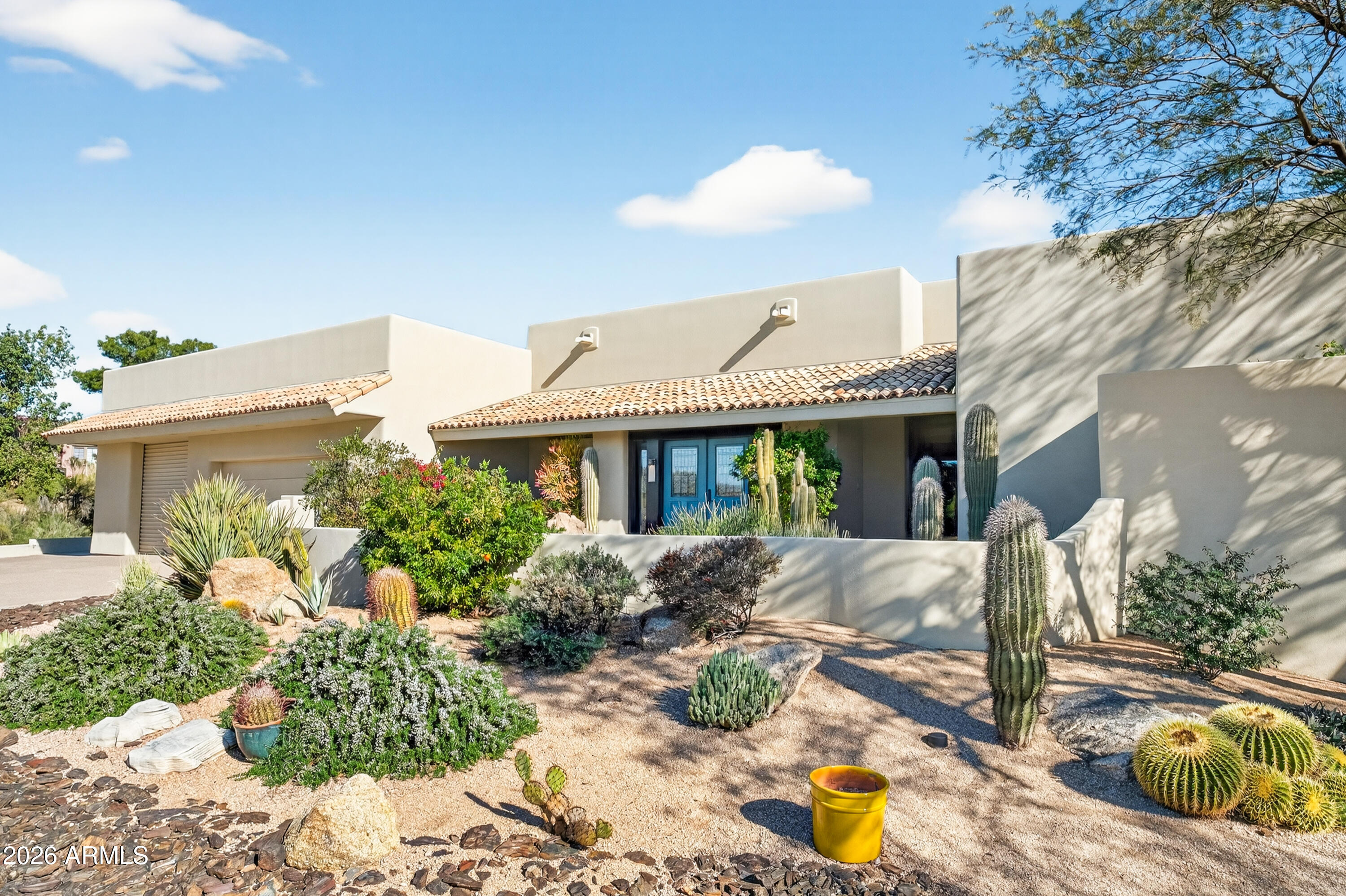 Two (2) Complete Homes !!  Main Home (3,221 sq') w/3 ensuite bedrooms,half bath open floorplan serves both casual and formal entertaining w/ huge double sided fireplace, well appointed eat-in kitchen plus oversized 3 car att garage for both vehicles and storage!....Separate Guest House (864 sq') w/2 bed/2 bath, full kitchen, living room, laundry plus att 1 car garage ! All this nestled on 1.17 beautiful desert acres in Carefree, AZ. This move-in ready, thoughtfully renovated, redesigned and meticulously maintained property offers both privacy and versatility,  and ideal for multi-generational living or hosting extended guests. Outdoor living is exceptional: low-maintenance desert landscaping, turf in the backyard, an expansive covered patio including a charming kiva fireplace.