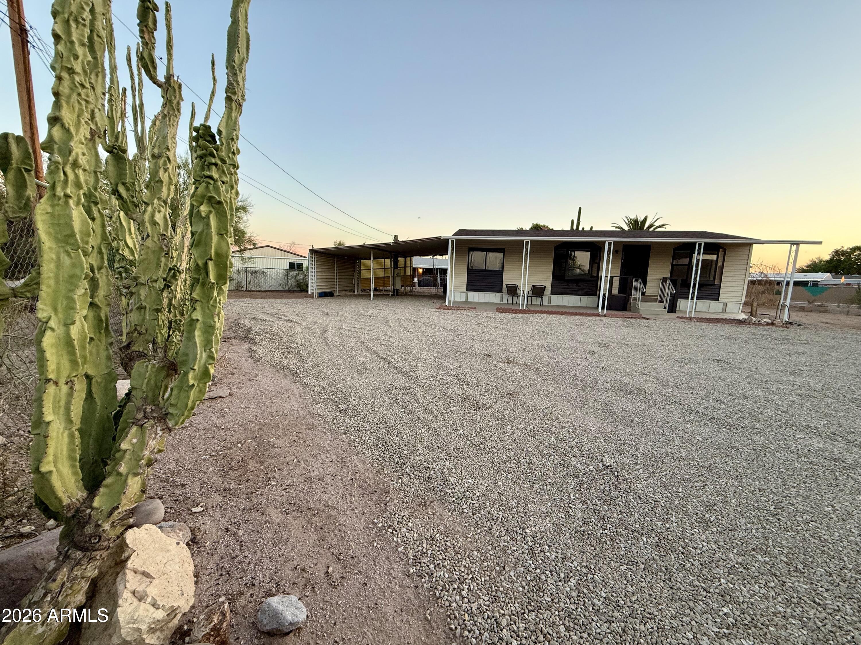 Get ready for mountain views, space, and no HOA on your own land. This updated 3-bedroom, 2-bath home sits on a spacious corner lot in Apache Junction with beautiful views of the Superstition Mountains. New AC and new water heater. This gated property offers a full RV hookup plus room for toys, trailers, and outdoor living near lakes and mountains.