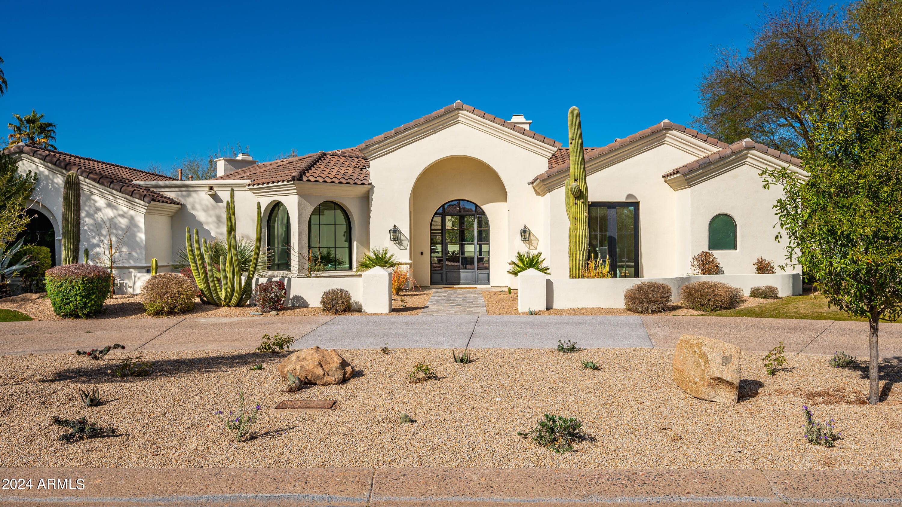 MDF Development and designer Lauren Wallace have recently completed this incredible remodel within the highly sought after guard gated community of Cheney Estates in luxurious Paradise Valley. What makes Cheney Estates so coveted is among all the 1 and 2 acre larger estates in Paradise Valley, Cheney Estates is the rare blend of a ''right size lot'' with the ''right size house''.  The interiors effortlessly blend timeless elegance with cutting edge design. The dream kitchen is a focal point, featuring an expansive island with top-of-the-line Sub-Zero/Wolf appliances adorned with Monte Blanc quartzite countertops.  The brick accents give the kitchen an elegant charm and texture. Recently completed pool and landscape create the Arizona's indoor/outdoor living experience everyone desires.