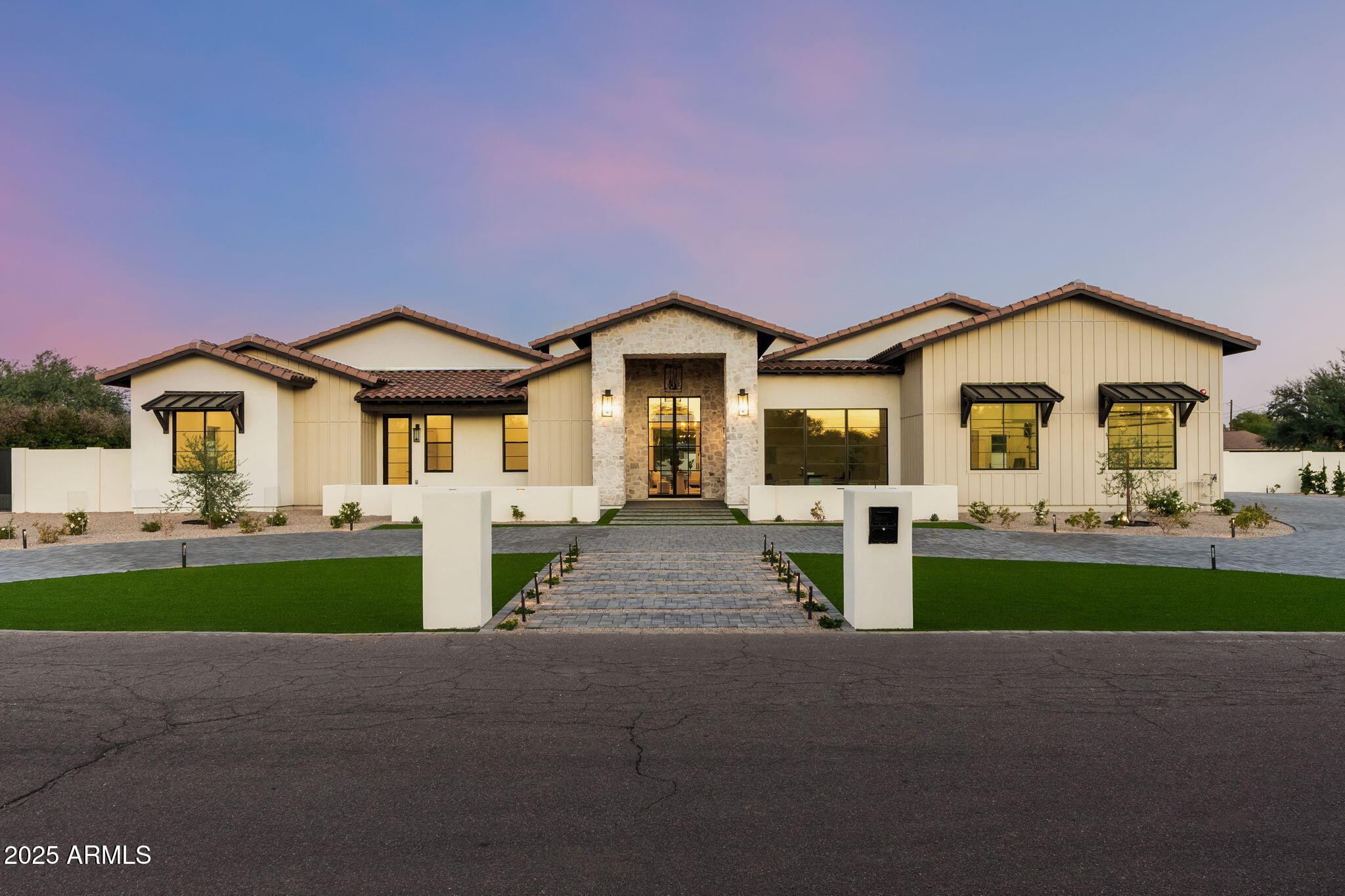 Welcome to a home that's about more than just space, it's about experience. Start your mornings with coffee in the sun-filled Kitchen, where floor-to-ceiling glass frames the McDowell Mountains. Unwind in the evenings in the airy great room, seamlessly connecting to the patio and pool, perfect for sunset swims or outdoor gatherings. Movie nights come alive in your private theater, while open living areas set the tone for effortless entertaining. Five spacious bedrooms, including an inviting master retreat with backyard access, offer a sense of privacy and sanctuary at every turn. Work and creativity flourish in a dedicated office with its own private entrance, offering a quiet retreat for focus and productivity. Additional flex spaces throughout the home adapt seamlessly to your lifestyle The chef's kitchen is truly the heart of the home, outfitted with high-end appliances, custom cabinetry, and a walk-in pantry - adjoining the formal dining space and a glass-enclosed wine room.  Set on a nearly acre, this home is moments from Scottsdale's premier golf, dining, and shopping. Hand-selected finishes, and intuitive indoor-outdoor living make every day more beautiful, more functional, and uniquely yours.