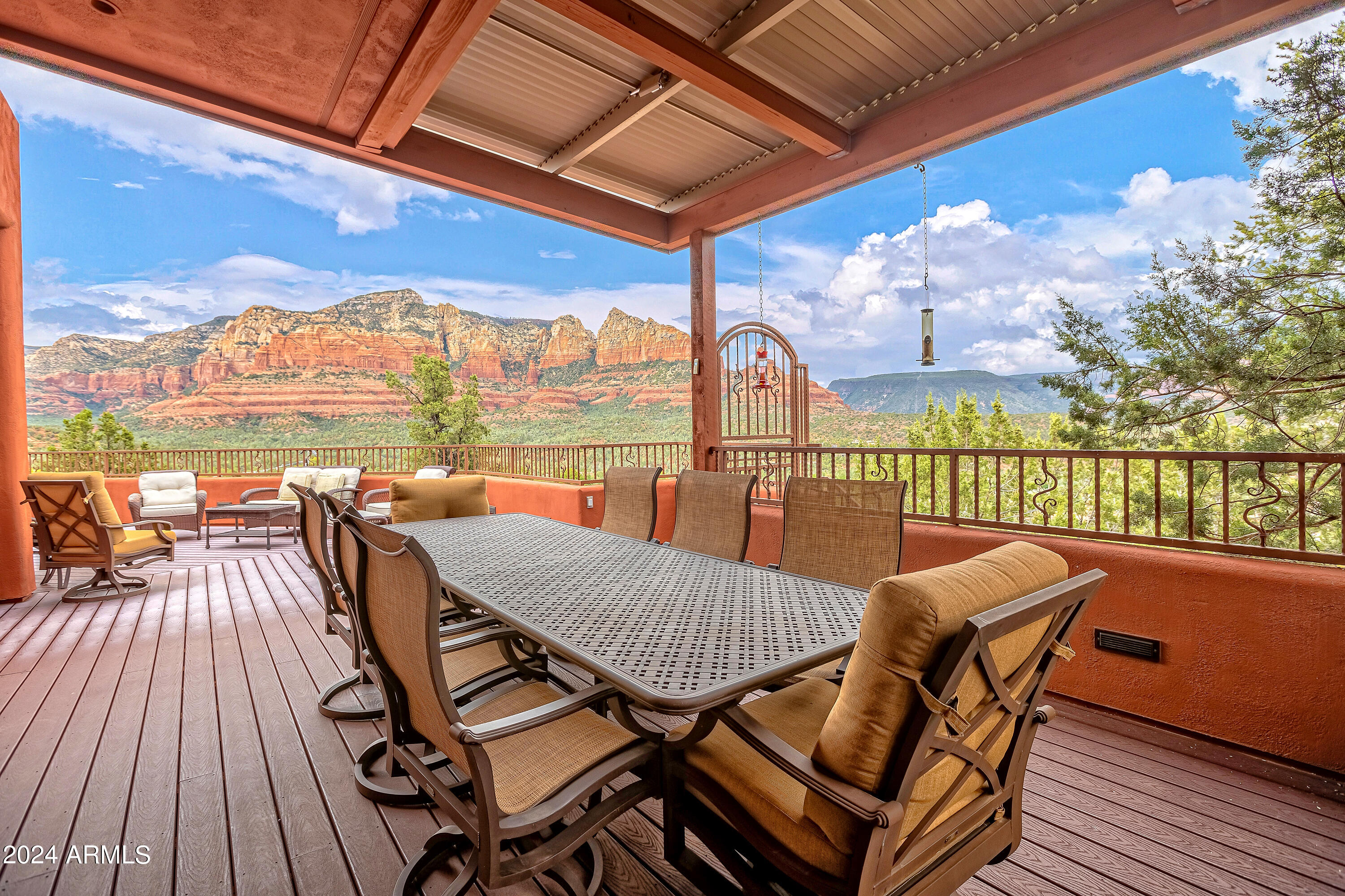 A Wine Enthusiast's Dream Home in Sedona
Fully remodeled in 2009. This exceptional estate boasts 3,577 square feet of thoughtfully designed living space, elevated to capture breathtaking 360-degree VIEWS that are simply unmatched.
The sellers have raised the roof to maximize the vistas, complemented by a sprawling 1,408 sq ft main deck and a 329 sq ft covered sky deck, creating an unparalleled indoor & outdoor living experience. The great room, expansive yet cozy, features a stunning beehive fireplace adorned with a unique Alligator Juniper mantle, making it the perfect gathering spot.
Retreat to the luxurious primary suite, where you'll enjoy direct access to your private outdoor hot tub &  star gazing. 3 Bdrms/3 bths on the main  w/ an office, bath & LR/ bonus room on the first level.