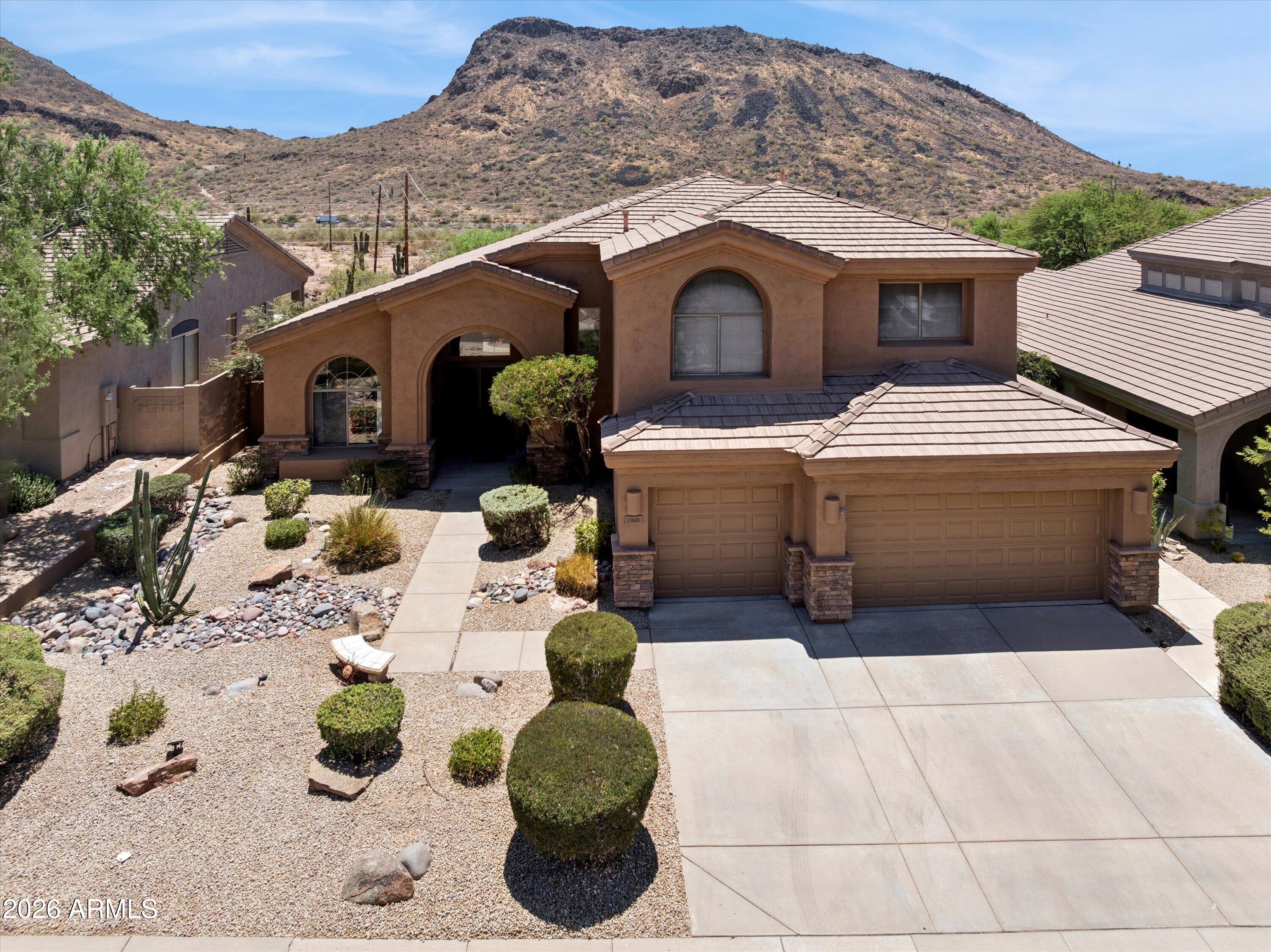 Step inside to discover a bright and airy multi-level floor plan with soaring ceilings, expansive windows, and abundant natural light that frame breathtaking mountain views and bring the beauty of the Arizona desert indoors. Offering 5 spacious bedrooms and 3 bathrooms, this versatile layout provides flexible living spaces for guests, a home office, hobbies, or multigenerational living. The open-concept kitchen flows seamlessly into the inviting family room, where a cozy fireplace creates the perfect gathering space. NEW AC units to keep you cool in the summer!
Situated on a private cul-de-sac lot, the resort-style backyard is designed for both relaxation and entertaining, featuring an infinity-edge pool, sweeping mountain views, and no neighbors directly behind for exceptional privacy. Located in Scottsdale's desirable Shea Corridor within the highly regarded Scottsdale Unified School District, serving Anasazi Elementary, Mountainside Middle School, and Desert Mountain High School. Just minutes from Mayo Clinic, the McDowell Sonoran Preserve, scenic hiking and biking trails, world-class golf, upscale shopping and dining, and convenient Loop 101 access, this home offers an exceptional combination of location, privacy, and Arizona lifestyle.