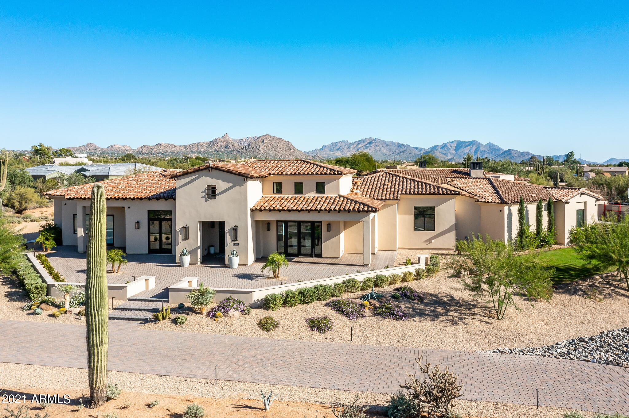 What you've been searching for. This 2020 custom build is not only the perfect size at 6,700 SF, but has 5 en-suite bedrooms, including a separate guest casita, office and exercise room, but is also sophisticated and boasts the quality finishes so desirable in today's market. Everything about this home works for a family and/or gracious entertaining: well thought out floorplan, light and bright chef's kitchen, 2 acre private lot, unobstructed views of Pinnacle Peak and the McDowell mountains, resort style backyard with outdoor kitchen, firepit, and so much more. Photos give you a sneak peak, but the home needs to be seen to understand how well the open plan flows from room to room and to the multiple outdoor areas and courtyards. No detail has been overlooked in this home and it is an opportunity not to be missed.