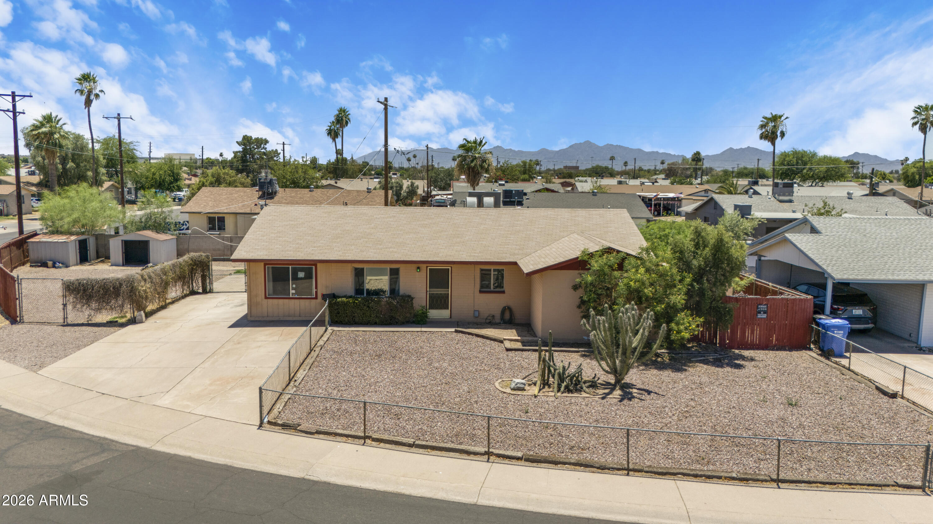Just 5 minutes from Loop 101, this rare opportunity sits on a 0.205-acre corner lot with NO HOA. Featuring 4 bedrooms plus a den, three RV gates, two storage sheds, a workshop, a covered patio, and an expansive backyard, this property offers exceptional space and flexibility for contractors, business owners, or buyers needing room for vehicles, trailers, equipment, or future projects. With plenty of usable outdoor space and a functional floor plan, the existing layout provides a strong foundation for renovation and customization, allowing the next owner to update the home to their own tastes and needs.