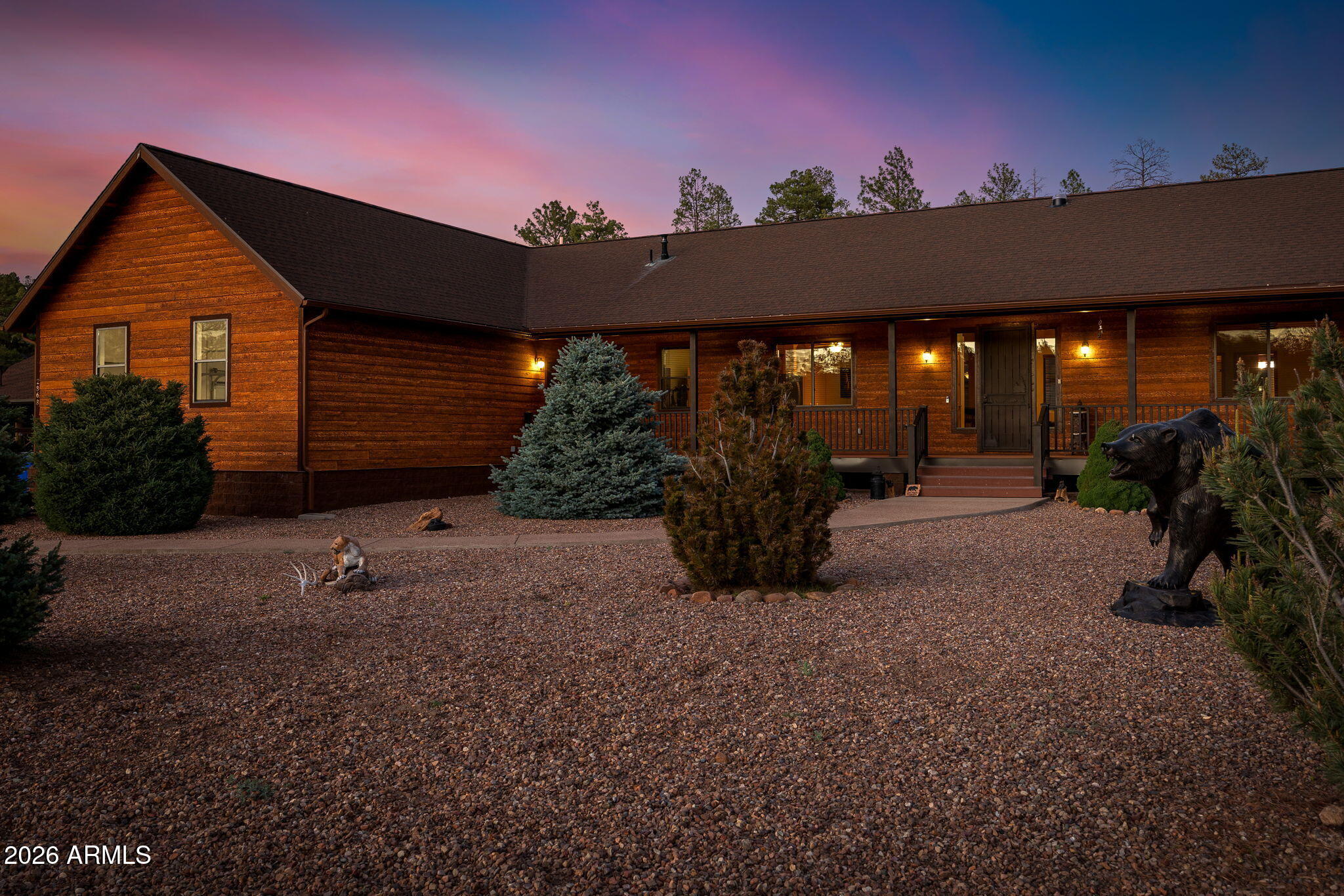 Experience mountain living at its finest in the highly sought-after Buckskin Artist Community! This exceptional custom built 3 bdrm, 2.5 bath home blends quality craftsmanship, comfort, and timeless mountain charm on a beautifully maintained .85 acre homesite. Pride of ownership is evident throughout this meticulously cared for property featuring stunning T&G interior and exterior accents, soaring vaulted ceilings, skylights, granite hard surfaces, and an inviting split floor plan designed for both privacy and entertaining. Being offered fully furnished, including mountain décor, this home is truly move-in ready and perfectly captures the warm cabin lifestyle buyers dream of.
The spacious master retreat offers double walk-in closets, dual sinks, separate shower, and a relaxing jetted tub, while the guest suite provides private bathroom access and its own walk-in closet. Thoughtfully designed with low maintenance siding, decking, and railing, plus an on-demand water heater and gas generator for added convenience and peace of mind.
Step outside and enjoy the expanded outdoor patio seating area complete with custom pavers and a beautiful arbor, creating the perfect setting for relaxing, entertaining, and enjoying the cool mountain air. The property is tastefully landscaped with a drip system, enhancing both beauty and ease of maintenance. Outdoor enthusiasts will appreciate paved road access and easy access to national forest trails for hiking, ATV riding, and year-round adventure. The impressive 1,500 sq ft 30x50 shop with 10' door is perfect for RV storage, car enthusiasts, hobbies, or workshop space also includes an add'l 1/2 bath and features a cozy wood burning stove for year-round comfort.  The attached three car garage provides even more room for vehicles and toys. Front and rear landscaping complete the picture-perfect curb appeal. Nominal HOA dues even cover water service, making this remarkable mountain retreat an incredible opportunity! Seller is Licensed Real Estate Agent in the state of Arizona.