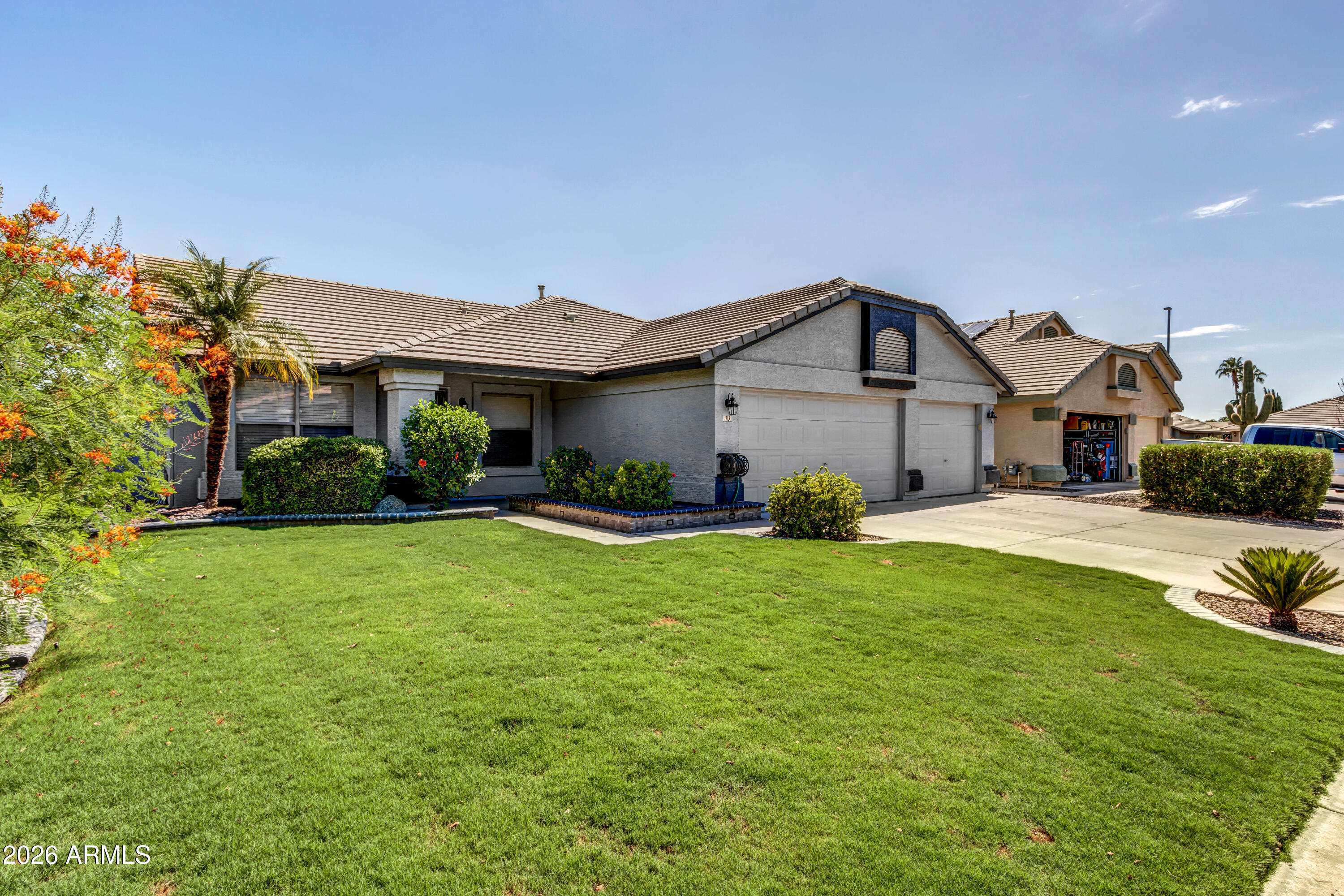 Welcome home to this single level 4 bedroom home in highly sought after Lindsay Ranch Neighborhood. Lush landscaping and charming front porch greet you upon arrival. Home boasts tile throughout with plush carpet in the bedrooms. Kitchen with stainless steel appliances and large island with breakfast bar that opens to family room. Neutral paint colors and an abundance of natural light. 3 car garage and a beautiful back yard with sparkling pool with waterfall and extended patio. Backyard oasis with low maintenance landscaping, large covered patio and sparkling blue pool with water feature