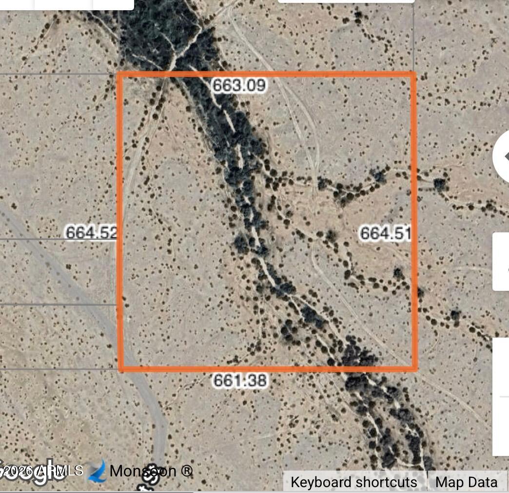 Mountain views on 10 acres ideally located in town but in a rural setting with an occasional stream that runs through the property.
