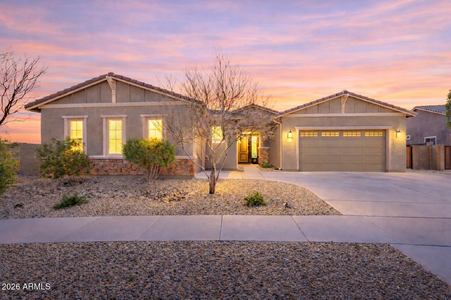 Welcome to modern luxury in Asante!  This expansive 3,100+ sq. ft. home on a large oversized lot boasts 4 bedrooms, 3.5 baths and a versatile den.  A standout feature is the attached CASITA complete with it's own kitchen, laundry, garage, and dual entrances.  The main home boasts 10' ceilings, plantation shutters, custom stacked stone wall, sleek tile throughout & a gourmet kitchen w/quartz counters, modern tile backsplash, gas range, large island & a generous walk-in pantry.  The owner's suite features a Spa like bath w/rainfall shower & dual walk-in closets along with direct patio access.  (see more for additional details). Seamlessly transition to the outdoor living space through double sliding doors that lead from the massive great room to a professionally landscaped paradise. The backyard is an entertainer's dream and features an extended patio, built in BBQ with bar, custom gazebo w/shades, putting green and a heated diving pool/spa.  With endless possibilities for entertainment and relaxation, this residence offers a blend of elegance and comfort that is sure to impress!