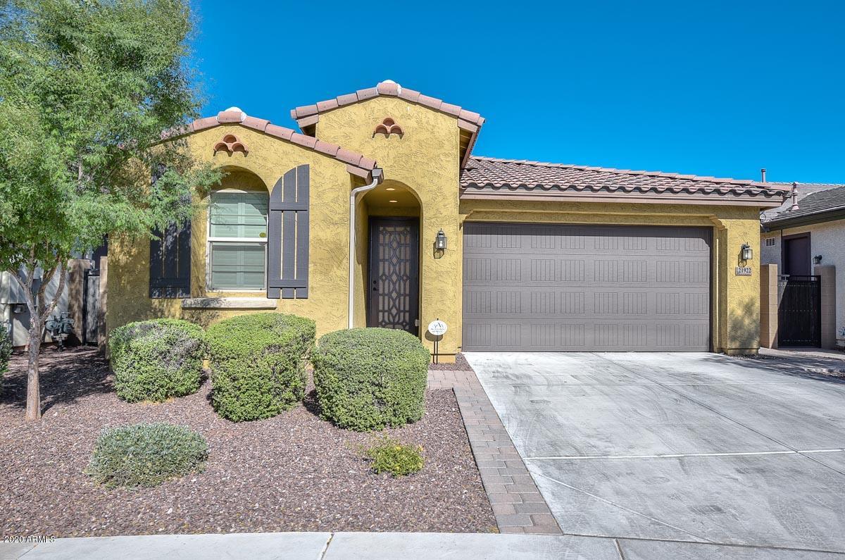 Amazing single-level, 3 bedroom, 2 bath home w/ 2 car garage that backs to a natural wash located in a great community with a pool, pickleball courts, clubhouse, volleyball and basketball courts and walking trails throughout. This great room plan has fantastic multi-slide doors leading out to the covered patio to expand your living space & to let the outdoors, in. The gorgeous gourmet kitchen includes gas Stainless Steel appliances, quartz countertops, a huge island & staggered cabinets.  Beautiful backyard with fire pit seating area, turf and pavers!  Added bonus: Landscaping is taken care of by landlord!This home is a MUST SEE!