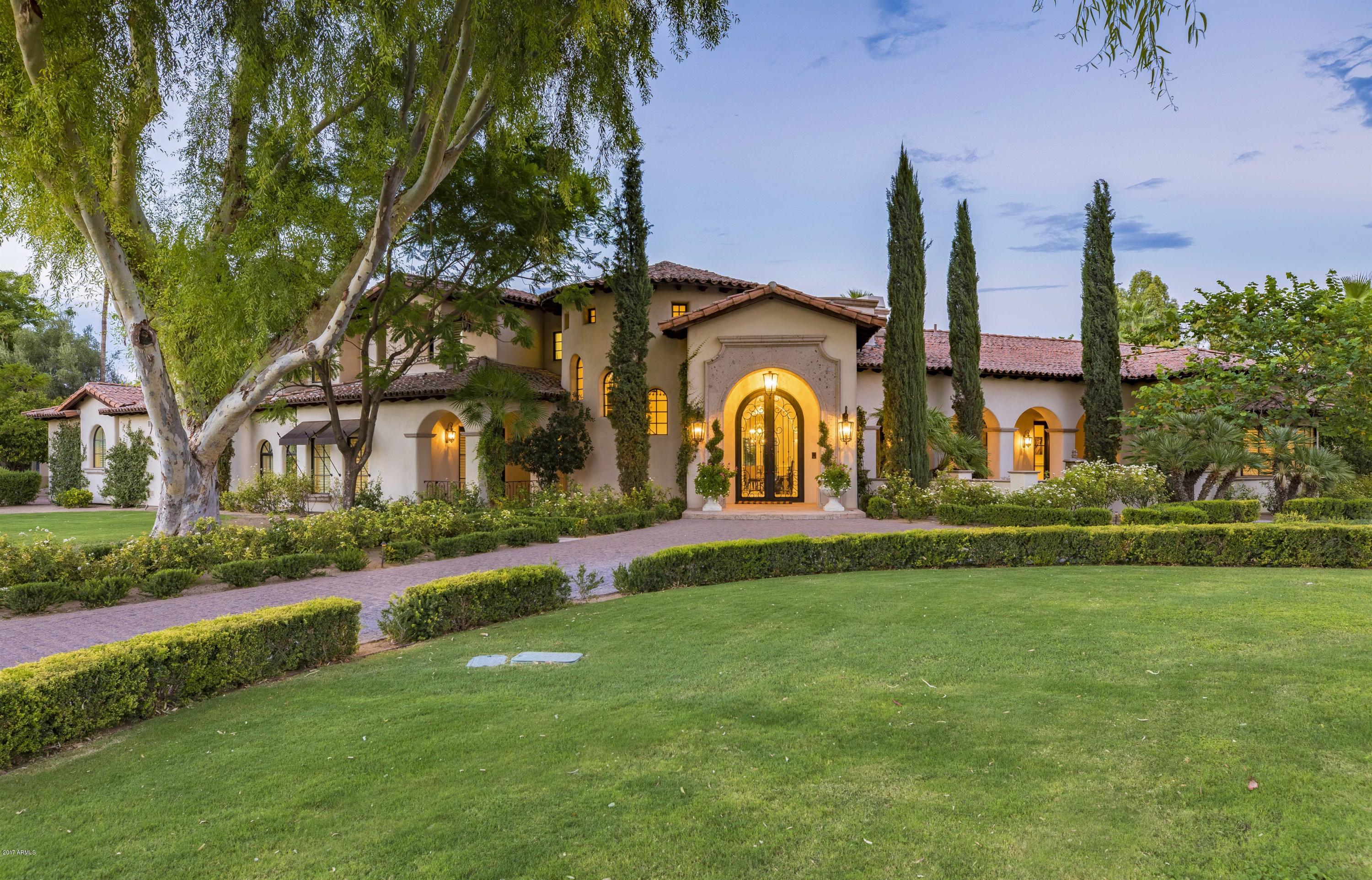 95K Price Improvement! Outstanding family home in highly regarded Camelback Country Estates.Now officially best in class value. Recently appraised at 3.5M, now offered at $362.00 per SF! Situated on over an acre of land with spectacular curb appeal. Separate 1200sf 1 BR ,1.5 BA guest house. Main house features three spacious en-suite bedrooms in addition to master, 7.5 BA, and four car garage. Gourmet kitchen with Viking appliances, game room, perfect family theater with seating for eight and wonderful entertaining bar. Private master wing features lovely sitting area with fireplace, dual walk in closets. Spacious master bath with separate vanities and jetted tub. Stone and wood floors throughout, custom cabinetry and soaring ceilings create light, bright living spaces. SEE MOTION VIDEO Resort style backyard is perfect for entertaining. Located in one of the best walking/cycling neighborhoods in PV.