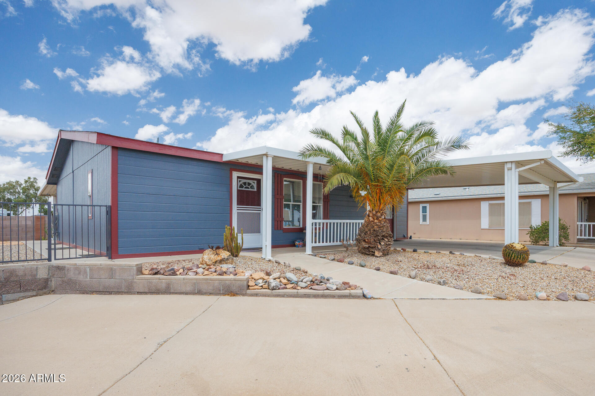 WELCOME HOME to this IMMACULATE retreat! Impeccably cared for 2 bed / 2 bath home, all appliances, including the washer and dryer, are included. Features NEW LVP flooring throughout fully fenced yard and only 1 adjacent neighbor. There is a full covered patio in the front and back. You can park 2 vehicles side-by-side in the covered parking with additional room for guest parking. New AC, new interior/exterior paint, new stove, Workshop/Shed for hobbies or storage. Come check out this amazing home in the Rodeo Estates 55+ Community, you won't regret it!!