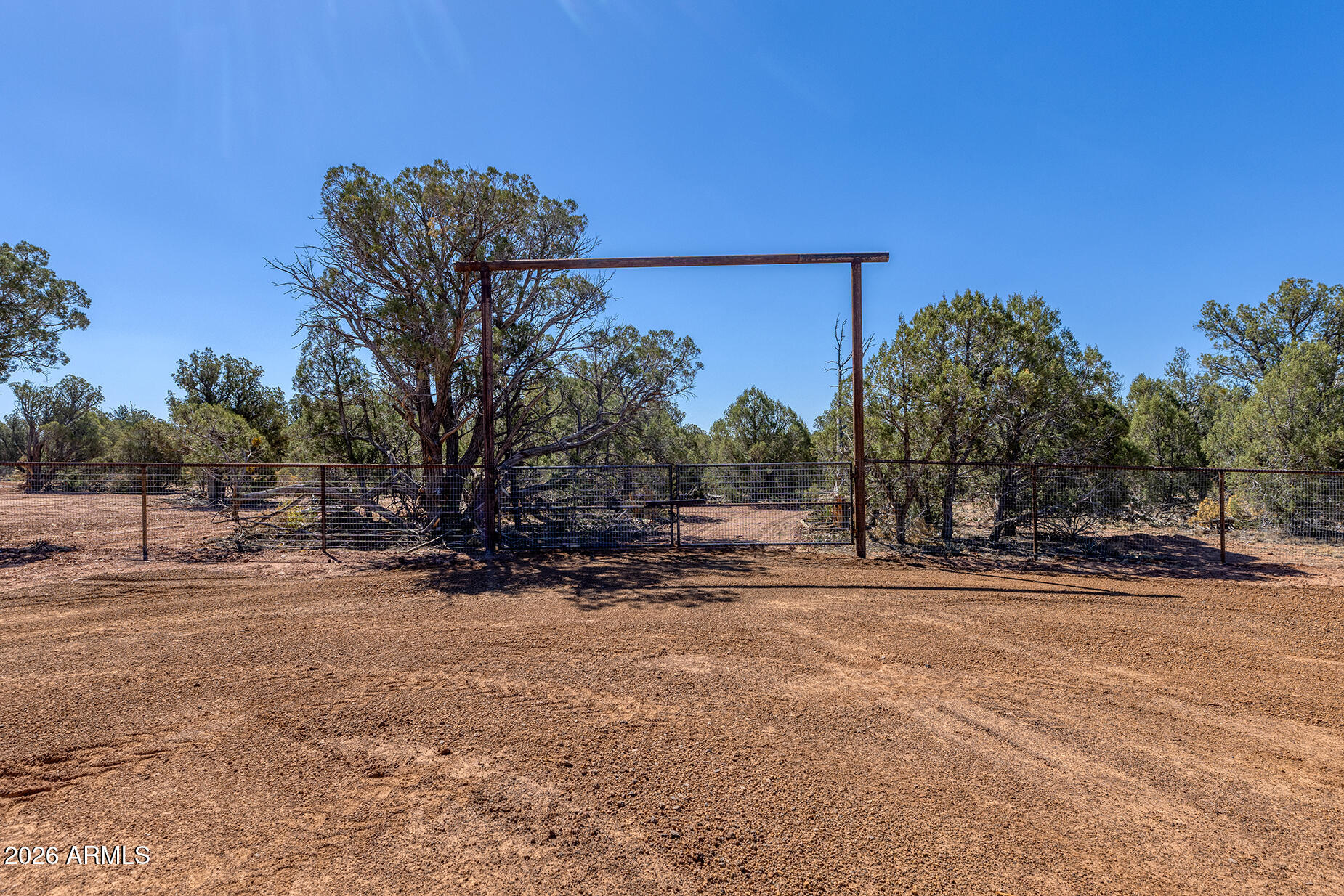 2.51 Acres of Opportunity in Show Low, AZ. Just miles from Linden, this beautiful parcel offers the perfect blend of privacy and convenience. Comes with a brand new private water well (5-year equipment warranty and a passing perc test! Enjoy being steps from the national forest, fully gated with no-climb fencing--perfect for animals & livestock Custom entry gates with extra-wide entrances make RV or trailer access easy. Plus, an equestrian trail runs right behind the property, connecting you directly to the forest! Build your dream home, hobby ranch, or getaway--this land is ready! **Two neighboring parcels with same updates are also for sale MLS 6987528 and 7007104**