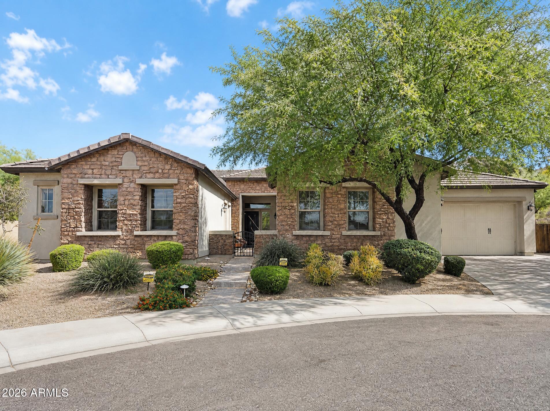 Million Dollar Views from this beautiful Semi-Custom Pulte Home.   The moment you drive up in your own Culdesac which backs up to Community Park and gorgeous views of Deems Hill.  Enter through a spacious courtyard which brings you to this custom iron door.   Inside you will find soaring 12 foot ceilings, open and very spacious floorplan, with an impressive built in wet bar with a wine fridge and sleek granite countertops.  The kitchen boasts custom staggered cabinetry with High End Monogram appliances.  Each Bedroom, has an ensuite bathroom and walk-in closets.  The Primary Bedroom is very spacious with its own sitting area and exit to the patio.  Outside you will love the breathtaking views and your own outdoor kitchen and Ramada.  On those hot days your own pool for some Summer fun. This home is remarkably well kept.  New Carpet and Interior paint make this feel like your moving into a brand new home.   One of the AC units were replaced in 2025.