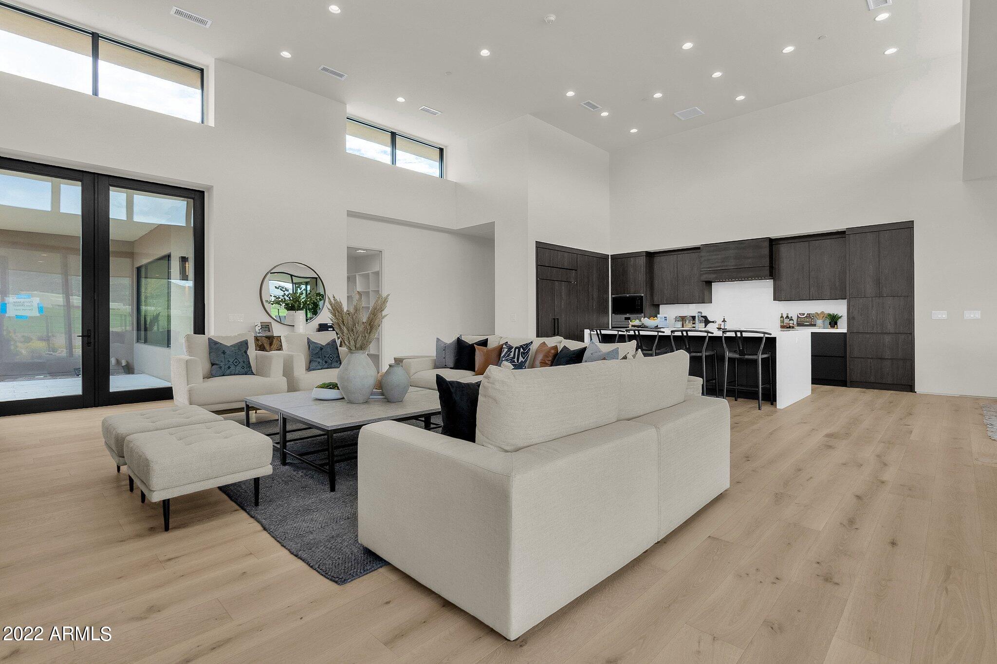 THE NEWEST COLLECTION OF LUXURY LIFESTYLE HOMES ARE NOW AVAILABLE AT THE EXCLUSIVE DESERT MOUNTAIN COMMUNITY. WELCOME TO THE VILLAGE AT SEVEN DESERT MOUNTAIN! THESE DISTINCTIVE ''LOCK-N-LEAVE'' RESIDENCES WILL BE BUILT BY CULLUM HOMES, 2018 CUSTOM HOME BUILDER OF THE YEAR BY THE NATIONAL ASSOCIATION OF HOME BUILDERS. 33 HOME SITES OVERLOOK THE 13TH HOLE OF THE RENEGADE COURSE, AND THE 10TH AND 11TH HOLES OF THE NEW PAR 54-RATED GOLF COURSE, NO. 7 AT DESERT MOUNTAIN. THIS MESQUITE FLOOR PLAN, IS A SINGLE-LEVEL HOME WITH LIVABLE SQUARE FOOTAGE AT 3713 SF, FEATURES 3 BEDROOMS AND 3.5 BATHROOMS, WITH A 3-CAR GARAGE. SPACIOUSLY LAID OUT SPLIT FLOOR PLAN. OPEN GREAT ROOM WITH A MODERN LINEAR-STYLE BUILT-IN FIREPLACE AND GLASS WALLS FOR VIEWS, WITH AN OPTION FOR INDOOR/OUTDOOR POCKET DOORS. FAMILY/GAME ROOM BETWEEN THE TWO GUEST BEDROOMS. FORMAL DINING AREA. KITCHEN AREA WILL HAVE A LARGE CENTER ISLAND WITH EAT-UP BAR SEATING, ALL STAINLESS-STEEL TOP-OF-THE-LINE WOLF SUB ZERO APPLIANCE PACKAGE, WALK-IN PANTRY. OWNERS SUITE WITH A SEPARATE EXIT OUT TO THE BACK YARD, DUAL SINK VANITIES IN THE BATH, SEPARATE SHOWER AND SOAKING TUB, WALK-IN CLOSET WITH BUILT-INS. TWO ADDITIONAL GUEST BEDROOMS, BOTH WITH EN-SUITE BATHS AND WALK-IN CLOSETS. LAUNDRY ROOM WITH EXTRA STORAGE SPACE AND LAUNDRY TUB AND A POWDER ROOM. HOMES ARE EQUIPPED WITH THE LATEST SMART-HOME TECHNOLOGY WITH FULL HOUSE AUTOMATION AVAILABLE. ENERGY EFFICIENT AND LOTS OF HEALTHY HOME FEATURES ALSO INCLUDED. FRONT YARD LANDSCAPING INCLUDED. HOMEOWNERS AT SEVEN DESERT MOUNTAIN WILL BECOME EITHER A LIFESTYLE OR EQUITY GOLF MEMBER AT DESERT MOUNTAIN, GAINING ACCESS TO ITS WORLD-CLASS AMENITIES INCLUDING THE NEWLY RENOVATED SONORAN SPA AND FITNESS CENTER, TENNIS COMPLEX, HIKING AND BIKING TRAILS, SIX ADDITIONAL PRIVATE GOLF COURSE, LUXURIOUS CLUBHOUSES AND RESTAURANTS. COMMUNITY IS GUARD-GATED 24/7 FOR THAT "LOCK-N-LEAVE" LIFESTYLE ONE SO DESIRES. HOME WILL BE COMPLETED IN APPROXIMATELY MARCH OF 2022.