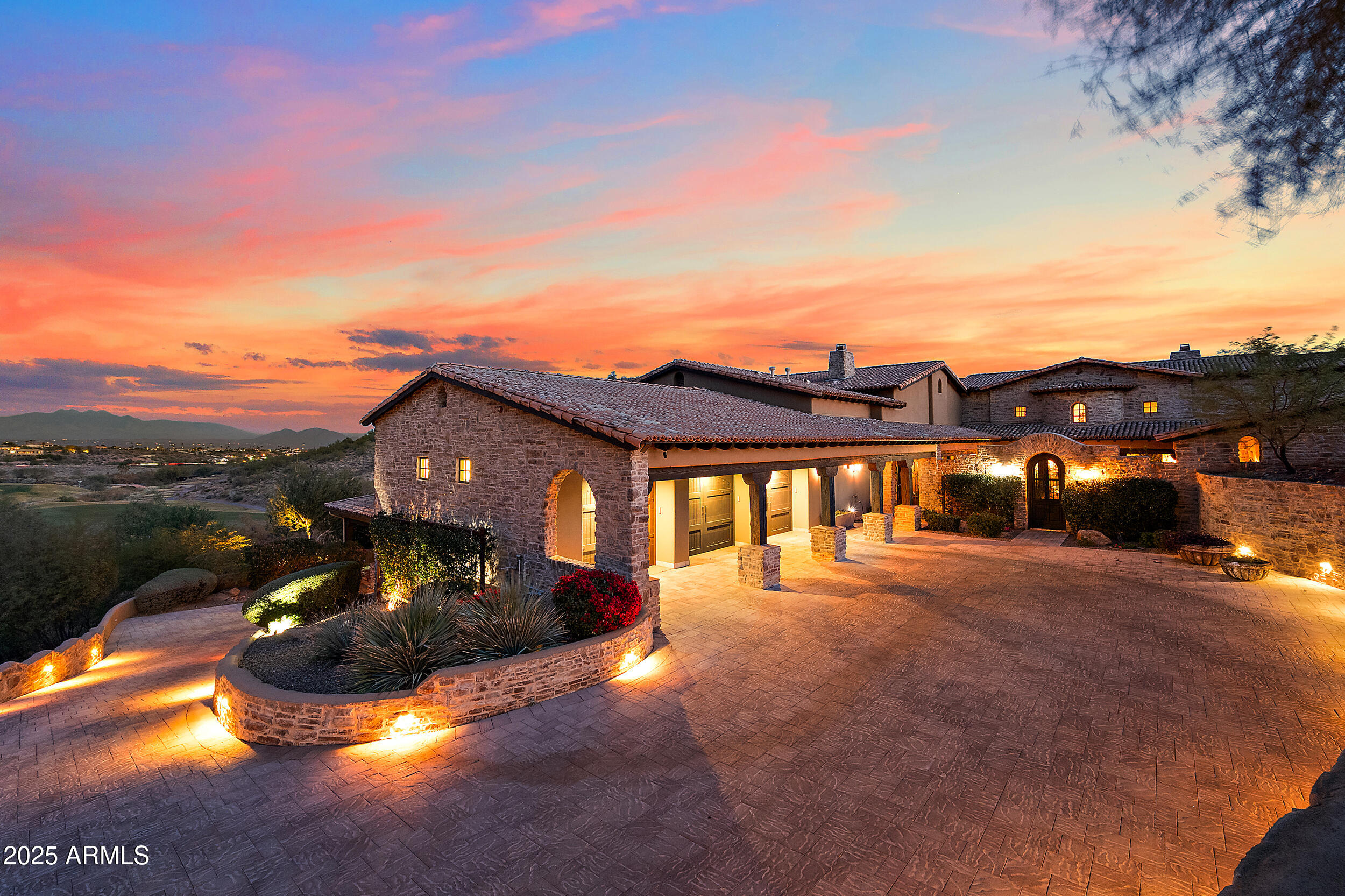 Embrace la dolce vita in this magnificent Tuscan estate, brimming with timeless Old World charm. Situated on a 1.79 ac lot the home is designed to capture views of Four Peaks, Red Mountain, and the Firerock Country Club golf course. A stretched paver driveway over a private bridge with whitewashed stone walls leads to a gated courtyard with bubbling fountains, fruit trees, and vibrant planters. Multiple sets of arched doors seamlessly connect the courtyard and terraces to the heart of the home, creating an effortless indoor/outdoor lifestyle. Inside bespoke architectural details include 18-20' dramatic dome and wood-beam ceilings, imported stone, hand-carved woods, 10' Cantera fireplace, and Venetian plaster walls.  The home is one level with spacious 5 bedrooms/ensuites + seperate guest casita. Outdoor living is the showpiece with expansive terraces and a tiered pool featuring a two-story waterfall, stone slide, and plunge and play pool. Turnkey elegance awaits as furnishings are included. This extraordinary estate is one to be experienced in person to fully appreciate its artistry, scale, and one-of-a-kind details.