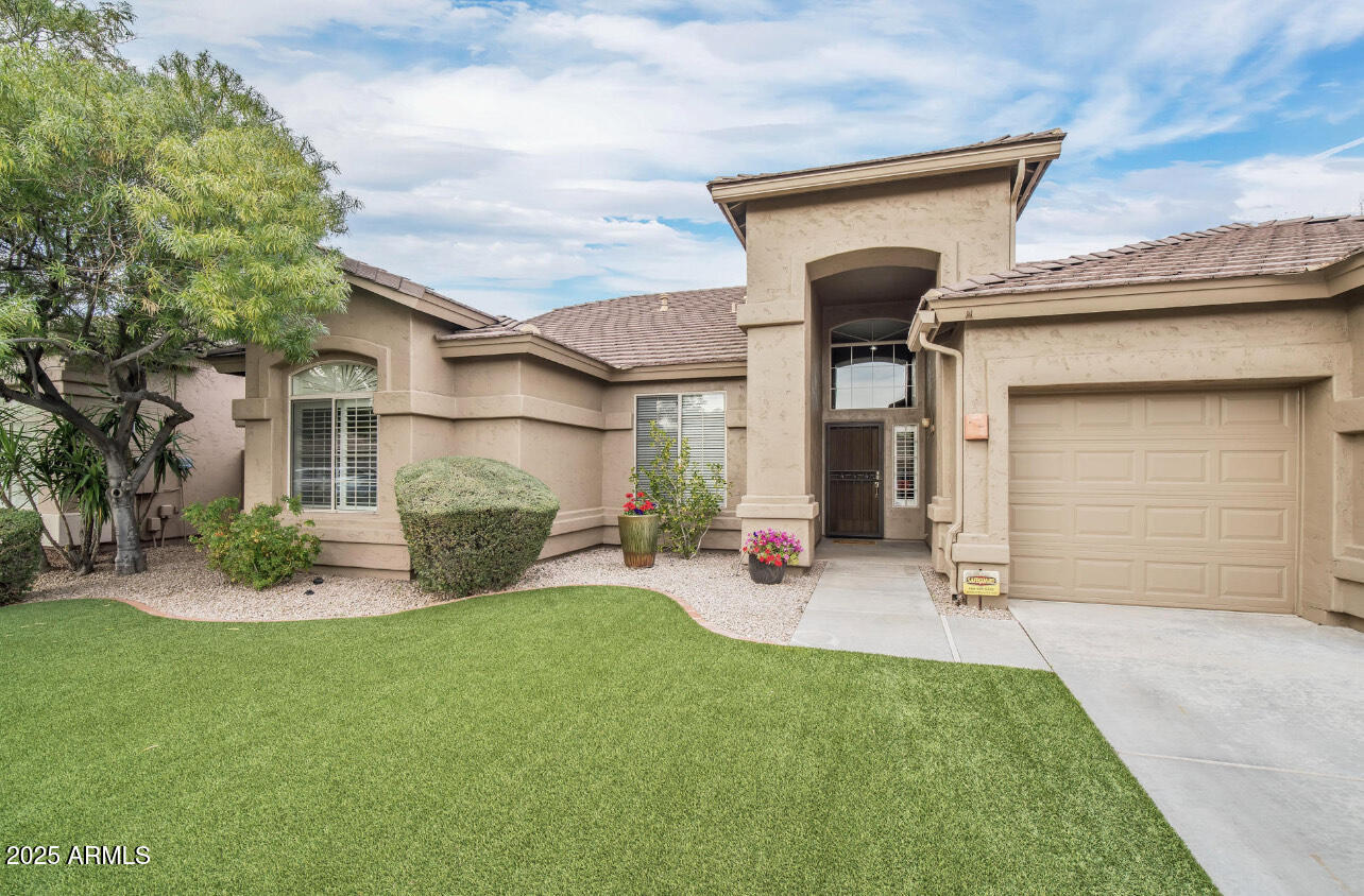 An absolutely charming home in the coveted zip code of 85254. Conveniently accessible to everything, this ideal location offers a peaceful environment. The house has a lot of improvements, such wood floors and shutters. The kitchen connects to the family room for effortless entertaining and features granite countertops and stainless steel equipment, including a wine refrigerator. A spacious master suite with a huge shower and separate tub is part of the amazing split floor layout. This beauty is completed with three more bedrooms, a Jack & Jill bathroom, a full guest bathroom, and a three-car garage. Savor the backyard paradise, complete with a welcoming pool and artificial grass that requires no upkeep. This house is a treasure that wont last long.