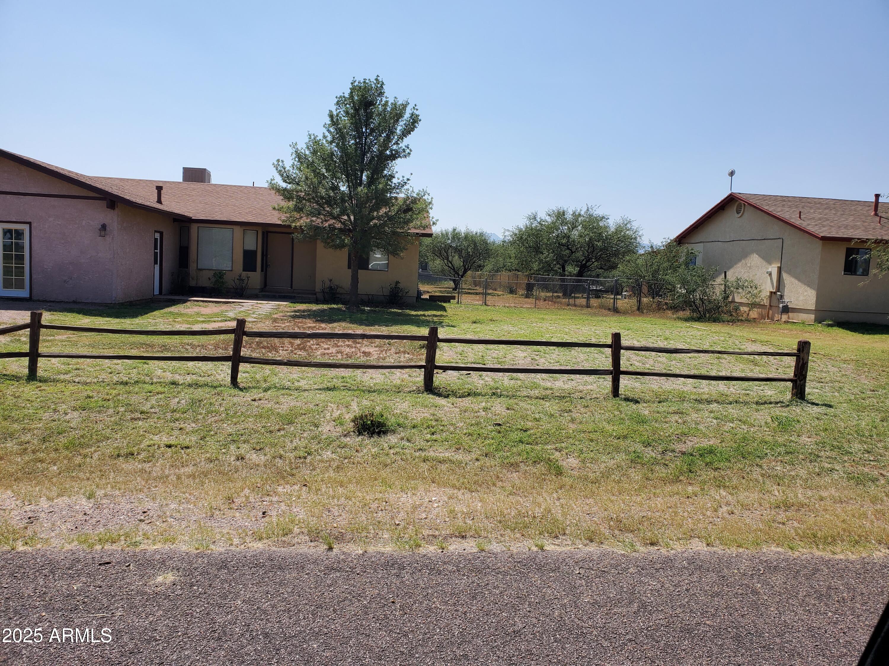 This home sits on a large corner lot.  Has 360 degree views. New roof was put on home 3 years ago. There is a covered patio in the back where you con look out at the mountains. There is tile through most of the home.  There is only carpet in the bedroom.  There is a large bonus game room with an a/c unit in the wall.