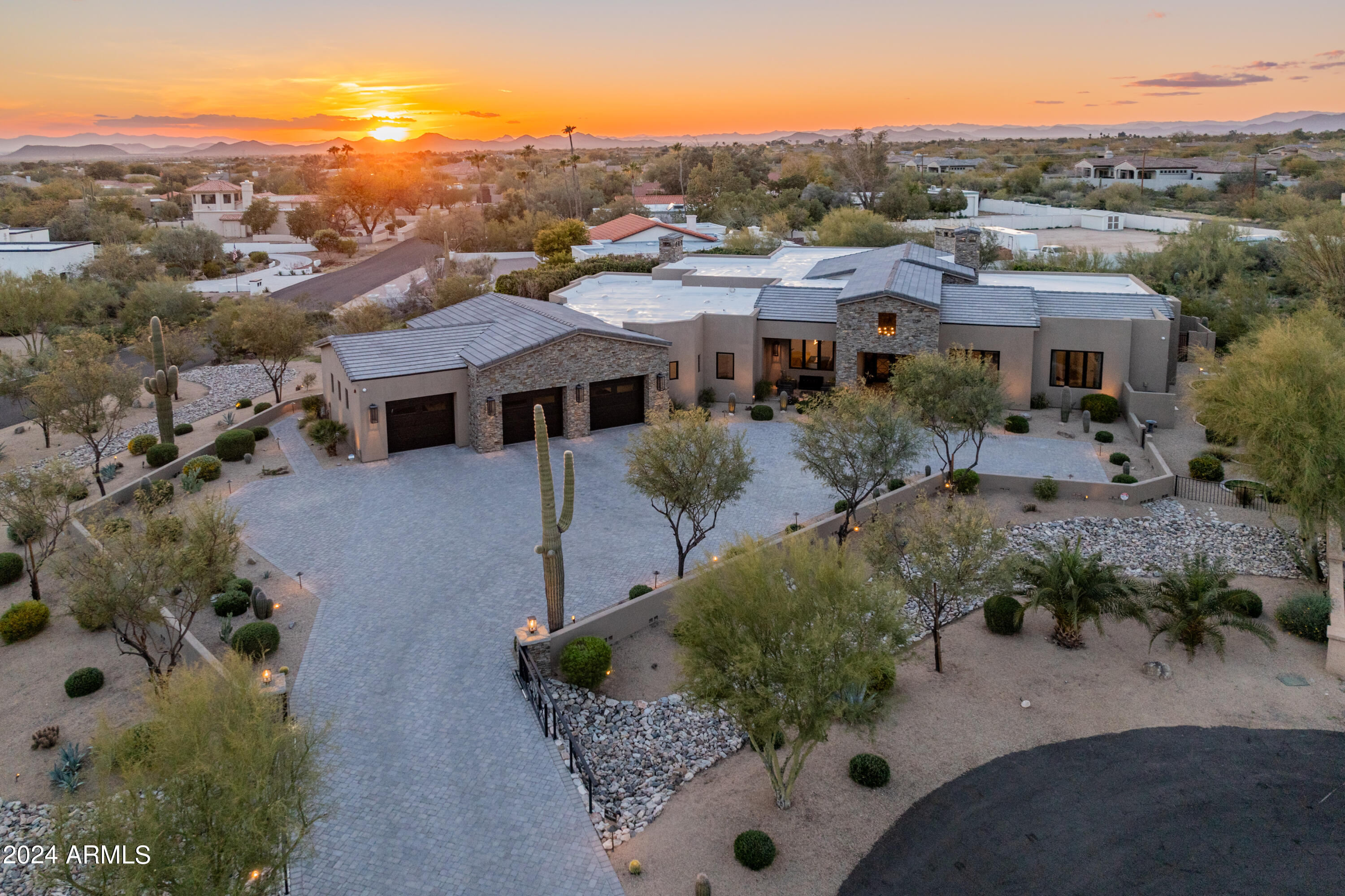 Absolutely stunning custom estate that will not disappoint. Carefully constructed & professionally designed (mostly RH furniture) in 2019, this meticulous acre+ property boasts luxury finishes throughout. The split & open floor plan offers 4 bedrooms (all ensuite), 4.5 baths, large office, convenient costco/storage room, and an oversized (1500 sqft) 3 car garage. The impressive great room features a beautiful gas fireplace with stone detailing, custom glass pocket doors designed for seamless indoor/outdoor living, and a formal dining room. The chef's kitchen is equipped with a large island, deluxe butler's pantry, beautiful custom cabinetry, and luxury appliances (Sub Zero & Wolf). The primary suite boasts a gas fireplace, private patio exit, and spacious bathroom with marble (floor, shower, countertops), dual vanities, large walk-in shower, separate soaking tub, toto toilet, and an oversized closet with island. Down the primary hall is a gorgeous powder bath, expansive laundry room, storage room, and entry to the large garage. The guest wing of the home features three guest suites all with uniquely designed bathrooms, plus an office/bonus room that opens to the great room.

The backyard sanctuary includes a heated pool and spa w/ relaxing water features, a private primary suite patio with outdoor shower, and a turf yard with a newer 5-hole putting green & chipping pad (2023). The large covered/uncovered patio includes an outdoor kitchen with built-in BBQ, gas fireplace & commercial misting system making this the perfect space to enjoy year round. Additional upgrades and features include exterior paint (2023), landscaping (2024), over 30k in light fixtures, Anderson windows & sliding doors, gated & pavered driveway, mechanical sun shades, Trane 18 Seer multi-zoned AC/heat pump system (3 units), multiple smart home features, and much more throughout. Plus, most of the furniture & furnishings are available on a separate bill of sale to make this a smooth & easy move-in.

This smaller north Scottsdale neighborhood provides a serene & private setting yet is only minutes from all that Scottsdale has to offer. This home is truly immaculate and an absolute must see.