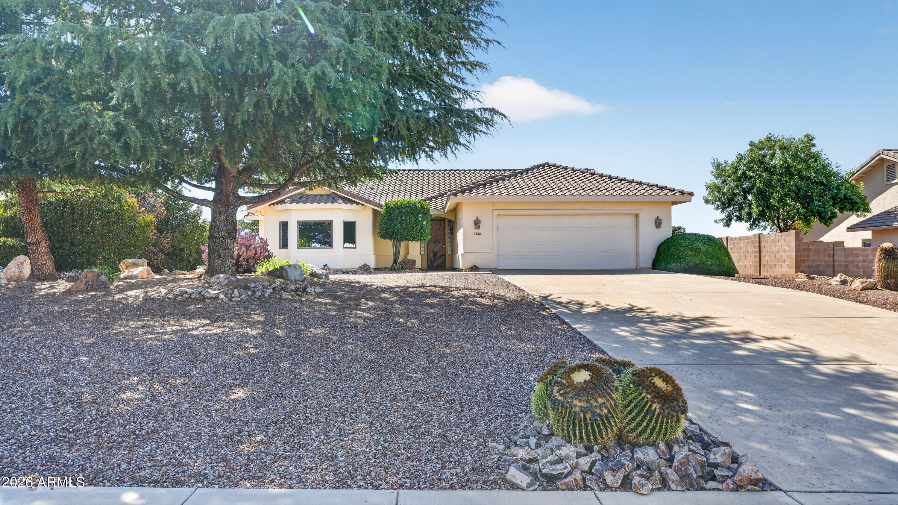 Enjoy peaceful living in the gated La Terraza community with unobstructed mountain views. This custom-built Cunningham home features a spacious great room with a cozy fireplace and a large picture window that brings the outdoors in. The open kitchen offers Corian countertops, abundant cabinetry, a center island, and includes the refrigerator. The primary suite features a walk-in shower, garden tub, dual vanities, private water closet, and walk-in closet. A generous laundry room includes the washer and dryer. Outside, enjoy a covered patio with remote-controlled roll-down shades, a 2-car garage, and well-maintained landscaping.