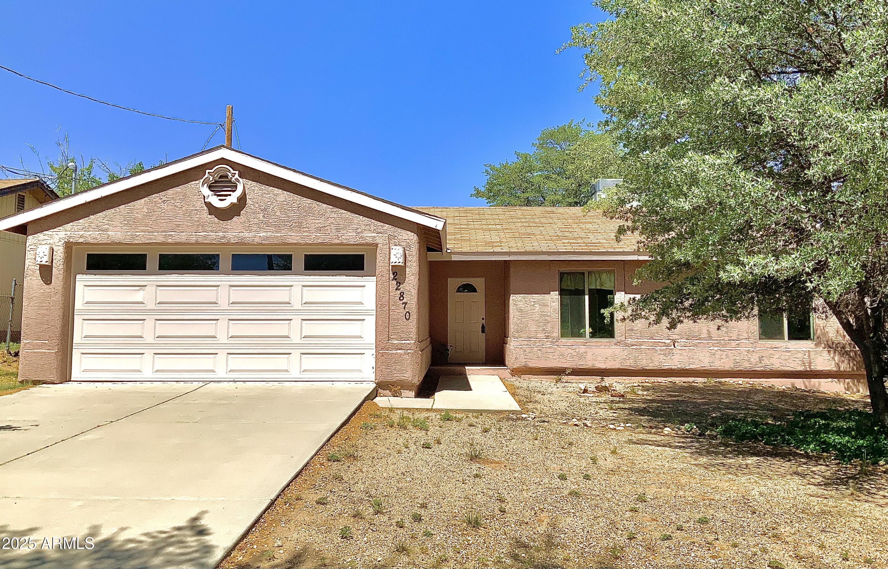 Escape the heat and city living to the tranquil life in Yarnell. At 4800 ft elevation you will enjoy 4 season weather, clear blue skies and great community minded town. This open floorplan 3bd, 2ba home with split ensuite is ready for you to move in and enjoy country living. Beautiful oak trees shade the home. Enjoy mountain views as you have your morning coffee on the back patio.  Newly painted exterior, light and bright interior, kitchen nook with views of mountains to the west. So much to offer, don't pass this one by!