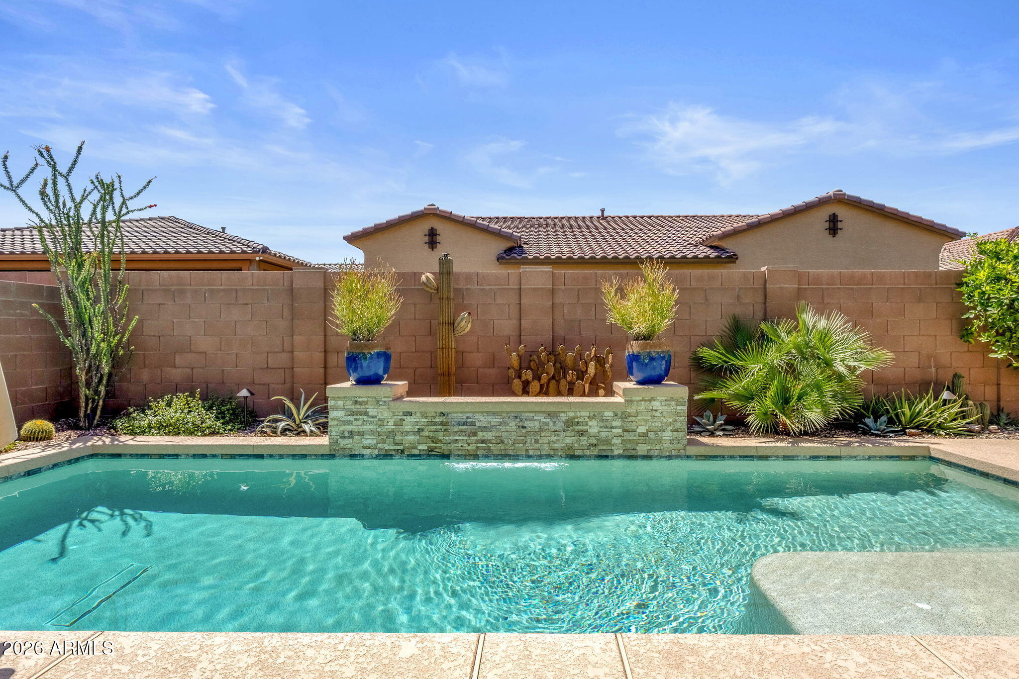 Enjoy a swim ready pool WITH a chiller.  Yes, you can chill the pool!  Impeccably maintained and better than new, this single-level Queen Creek home offers a perfect blend of style, comfort, and functionality. Gently lived in, the home showcases a well-designed layout and a beautifully appointed kitchen that anchors the open-concept living space, ideal for both entertaining and everyday living.  The smart floor plan provides a seamless flow throughout, creating a spacious yet inviting atmosphere. Step outside to enjoy a private backyard complete with a sparkling pool, offering the ultimate Arizona lifestyle.  Ideally located near Queen Creek's top shopping, dining, and amenities, with convenient access to Gilbert and major freeways, this home combines peaceful living with everyday convenience.  Perfect for first-time buyers or those seeking a low-maintenance, move-in ready home in a highly desirable area.