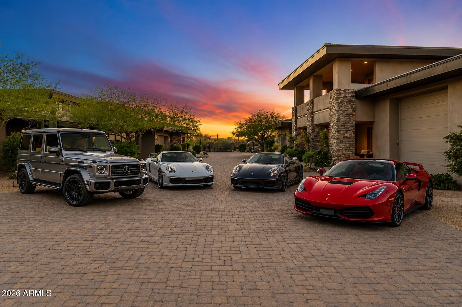 Set against a stunning 4.3-acre North Scottsdale backdrop, NO HOA masterclass desert luxury living, framed by panoramic mountain vistas and glittering city light views, for an avid collector. The 6,800-square-foot main residence is designed for both grand-scale entertaining and refined all-in-one level daily living, featuring a magnificent great room, a professional chef's kitchen with a wet bar, and a dedicated (second-level) media/billiard room. The home is thoughtfully tailored for the modern professional with dual executive offices, while the primary sanctuary offers a fireplace, coffee station, and a decadent, spa-inspired bath. The grounds are a paradise for the collector and the host alike, headlined by a massive 12-car/12-ft RV garage Door and a gated motor court. The outdoor oasis features oversized patios, an alfresco kitchen, a heated pool and spa positioned to capture the sunset. Completing this desert compound are TWO detached, fully equipped guest HOMES with private kitchenettes, situated across a charming front courtyard to ensure ultimate privacy for visitors. This is a rare opportunity to own a sophisticated retreat that balances immense scale with intimate, high-end detail.
