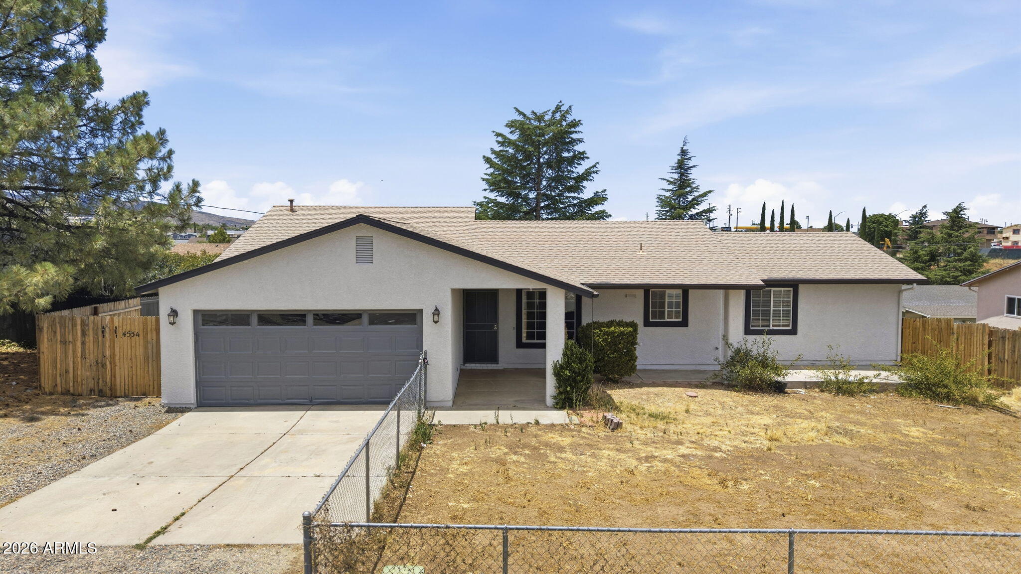 Located in the heart of Prescott Valley, this 3 bedroom, 2.5 bathroom home offers 1,541 sq ft of comfortable living space. The open floor plan features vaulted ceilings that create a bright, spacious feel, while the kitchen with island flows seamlessly into the living and dining areas--ideal for everyday living and entertaining. The large primary bedroom features an ensuite bathroom and walk-in closet. Enjoy the fenced yard with room to relax, play, or entertain. Conveniently situated near Mountain Valley Park, schools, restaurants, and shopping, this home combines comfort, functionality, and a great location.