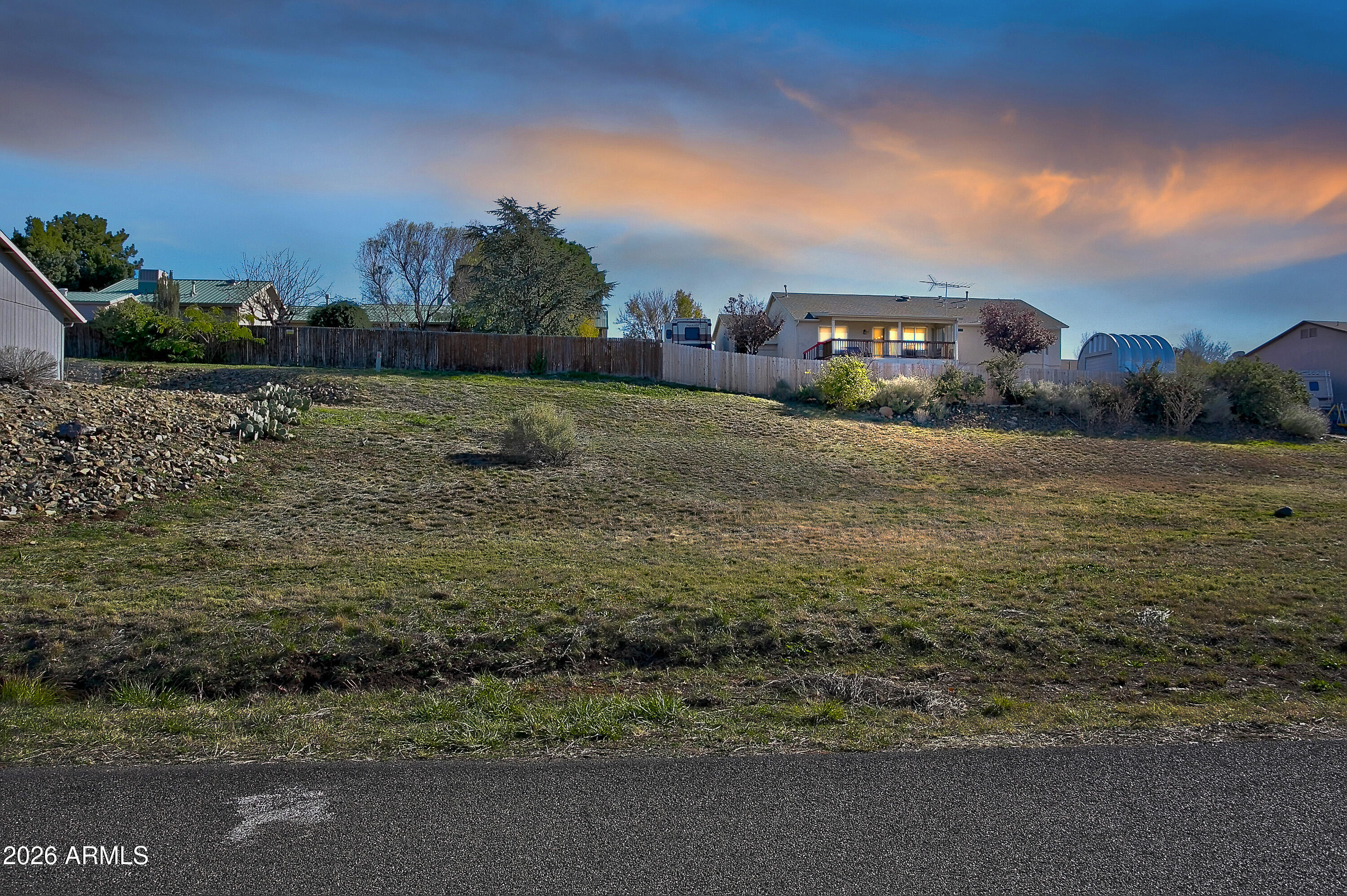 Discover a wonderful opportunity to build your dream home on this 0.26-acre vacant lot. This is a generous, buildable parcel in one of Prescott Valley's desirable neighborhoods. Nestled on a gently sloping, paved street, this lot offers the perfect balance of space and convenience. Plans Already Submitted: Save time and streamline your build — plans have been officially submitted to the Town of Prescott Valley, giving future owners a valuable head start toward construction. Whether you're pursuing a custom build, investing in a growing area, or looking for a ready-to-go project with plans already in motion, this property is a standout opportunity in Prescott Valley.