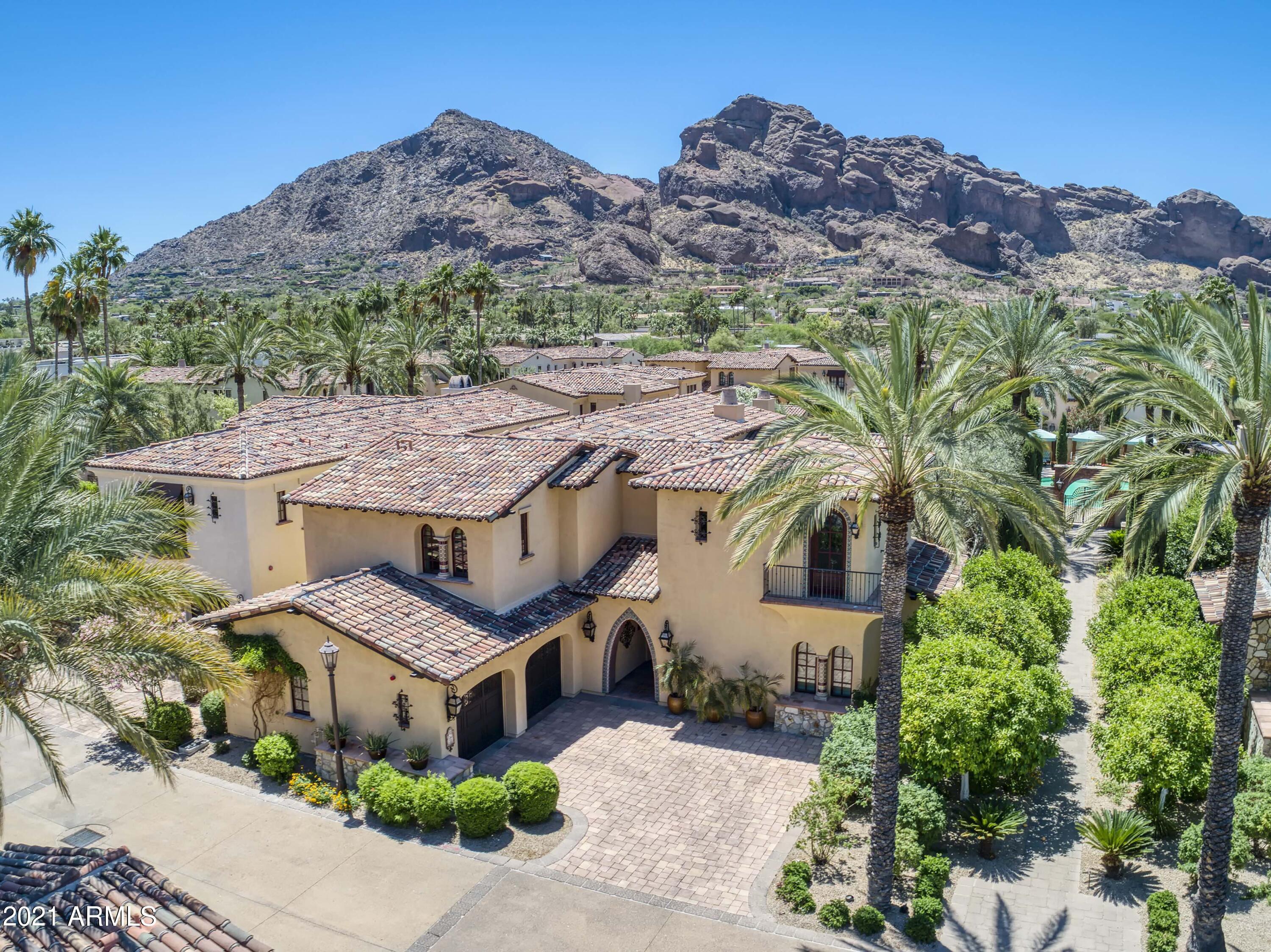 One of 34 exceptional luxury villas located in center of development, adjacent to community private pool/spa area. Original owner has over $4.0M into this build. The Montelucia amenities rival any resort property and this exceptional villa will not disappoint. Venetian plastered walls t/o, elegant elevator, inlay marble & wood floors, 550+ bottle temp-controlled wine room, two laundry rooms (1st & 2nd floors), dedicated office/media room, stunning views of Camelback Mountain from Master Bedroom's expansive covered patio and more. Chef's kitchen w/ Viking appliances, double dishwashers, Butler's pantry, including a gas 6-burner Viking professional-grade oven. Owners have access to Resort's workout facility 24/7, discounts on Resort services & access to the 3 Omni heated pools.