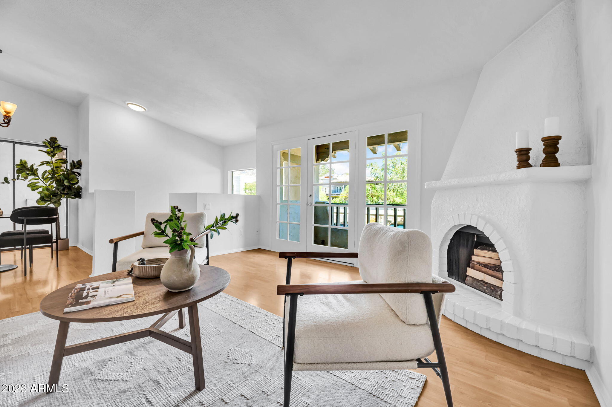 Wake up to stunning views of Piestewa Peak every day! Enjoy mountain, park, and pool views from your private patio! This condo is fresh and move-in ready featuring an in-unit washer and dryer, fireplace, French doors leading to a second private balcony, and two outdoor living spaces. The second balcony also includes a spacious storage room.
Enjoy the convenience of having Aunt Chilada's just a short walk away, while Piestewa Peak and Dreamy Draw Recreation Area are only steps from your door for endless opportunities for hiking, biking, and trail running. 
The community features a pool and BBQ area, while Hilton Phoenix Tapatio Cliffs Resort are nearby. Experience resort style living in one of North Central's most desirable communities!