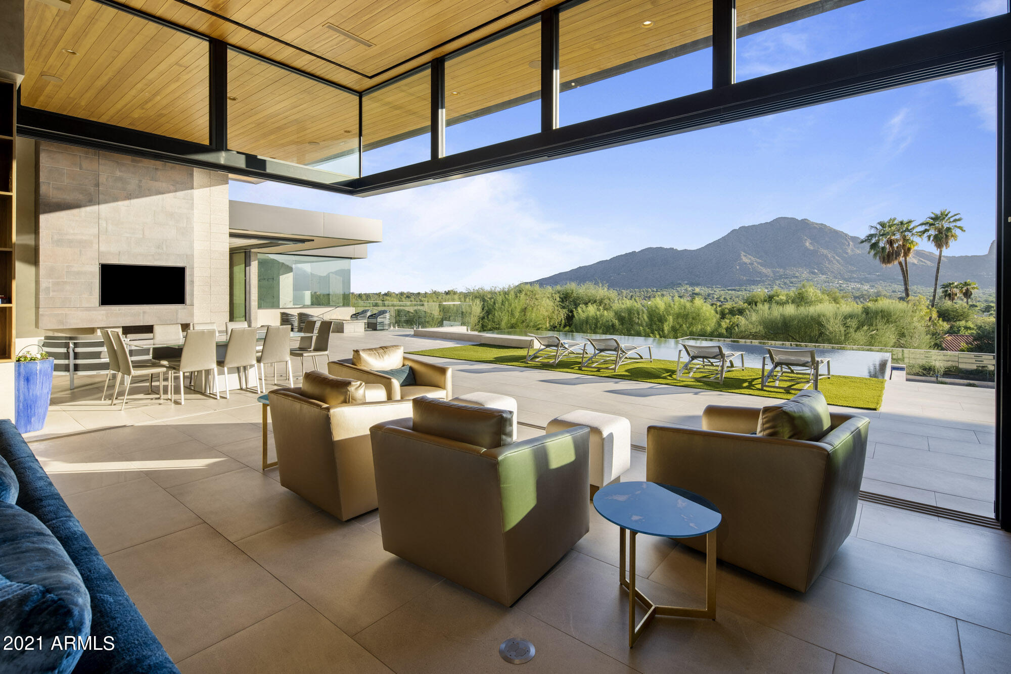 Hands down the most stunning home in Paradise Valley currently on the market. Another Drewett Works & Brimley Development masterpiece. The sleek lines of the home will draw you in where you will find unparalleled views of Camelback & Mummy Mountain! Vanishing floor to ceiling windows allow you to take in the breathtaking views making it without a doubt an entertainer's dream! 4 bedrooms, all en-suites, office, den, gym, bonus area(or 5th bedroom) & a gourmet kitchen complete with large island, custom cabinets and wine cellar which opens to an oversized great room...nothing has been overlooked. Zero edge pool & spa, plus amazing patios complete w/ an outdoor kitchen, bocce ball court and private courtyard. 6 car garage(room for 4 car lifts allowing for 10 cars) for the car enthusiast!!!
