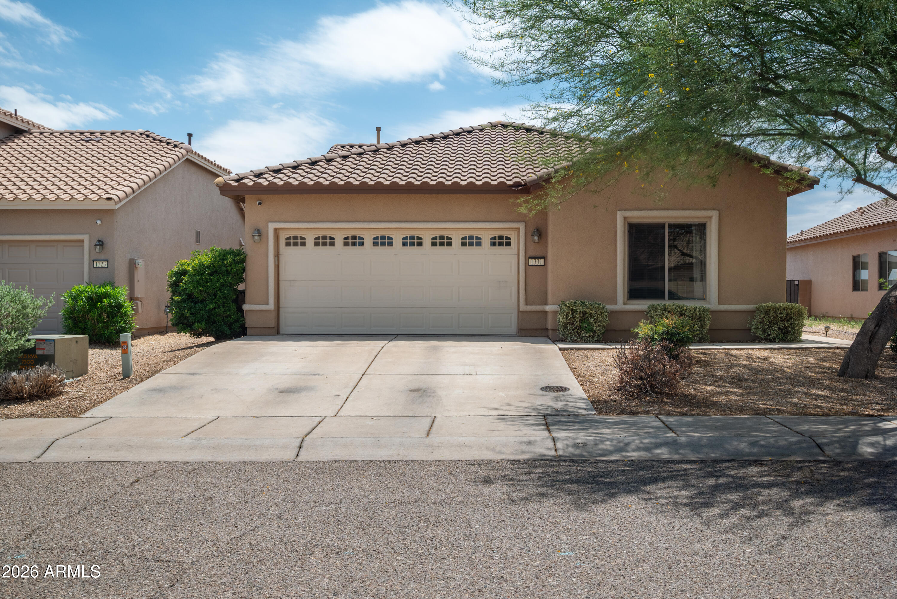 Welcome home to this beautifully maintained 3-bedroom, 2-bath home offering comfort, style, and a fantastic location! Inside, you'll love the tasteful interior paint, bright and inviting living spaces, and a functional floor plan designed for everyday living. Step outside to a beautifully landscaped backyard that provides the perfect setting to relax, entertain, or enjoy Arizona's stunning sunsets. With no rear neighbors and backing to open land, you'll appreciate the added privacy and peaceful views. Conveniently located just minutes from shopping, dining, schools, parks, and other everyday amenities, this home truly offers the best of both comfort and convenience. Don't miss your opportunity to make it yours!